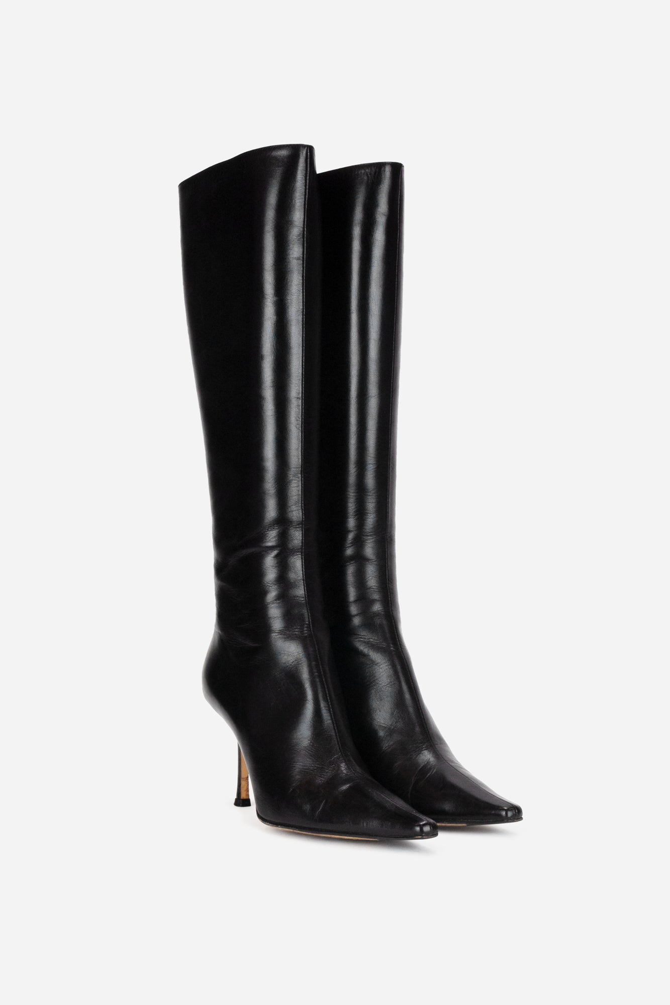 Black leather pointed toe knee high boots