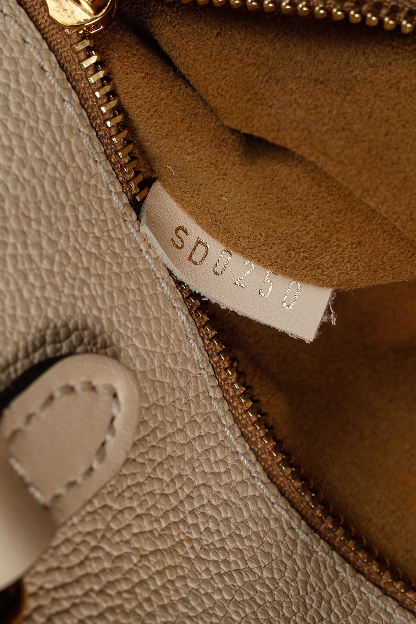 OnTheGo GM Creme Empreinte Monogram Leather Tote Bag