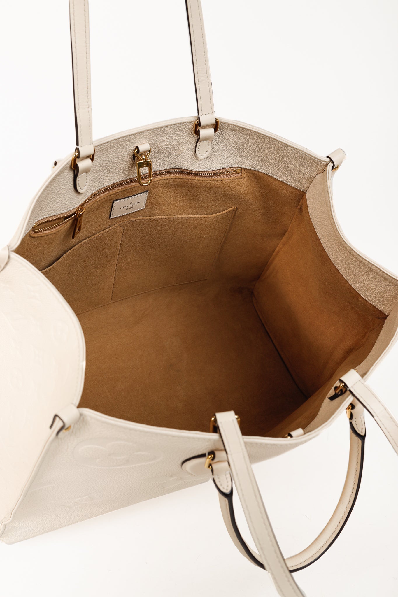 OnTheGo GM Creme Empreinte Monogram Leather Tote Bag