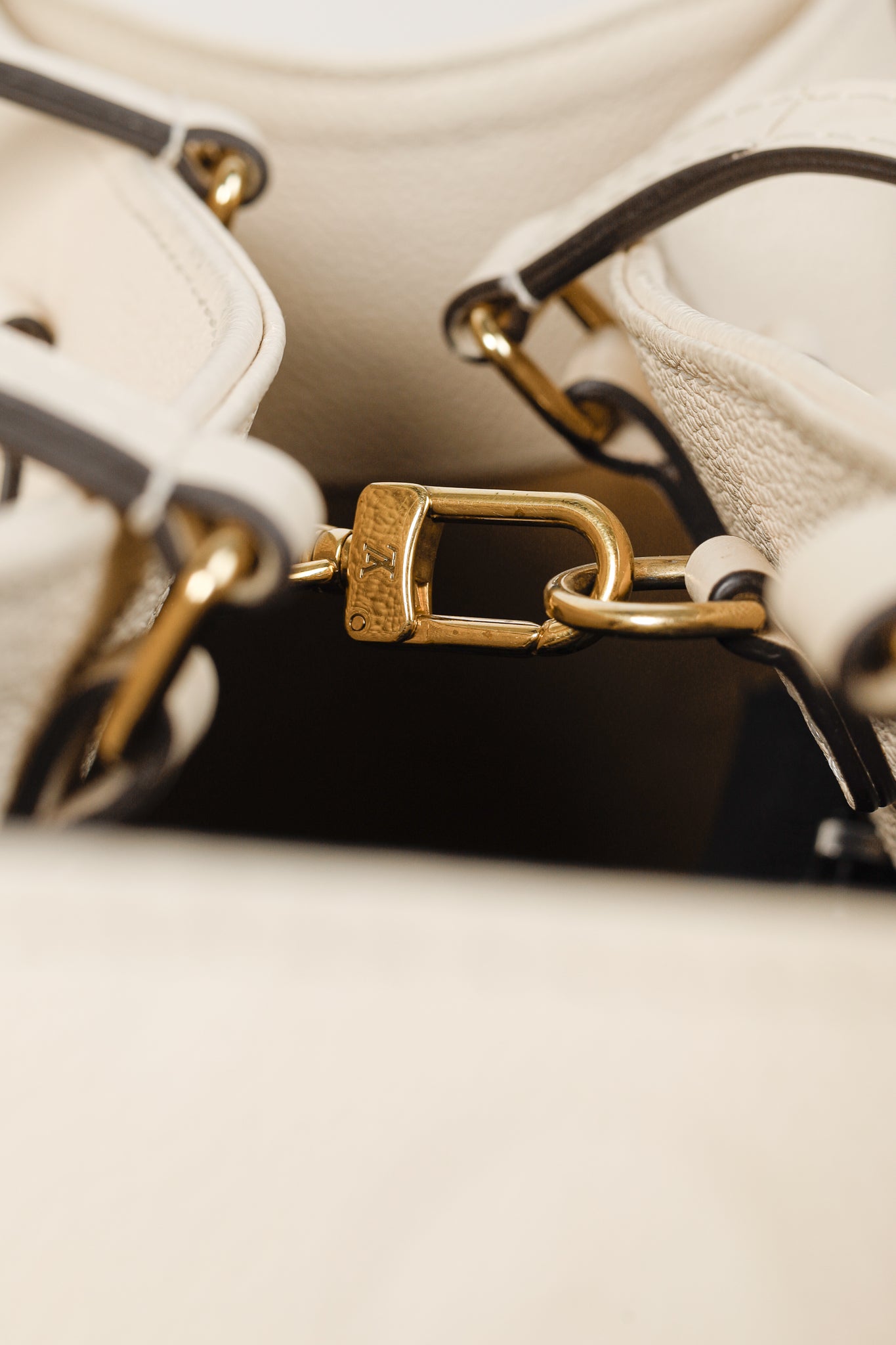 OnTheGo GM Creme Empreinte Monogram Leather Tote Bag