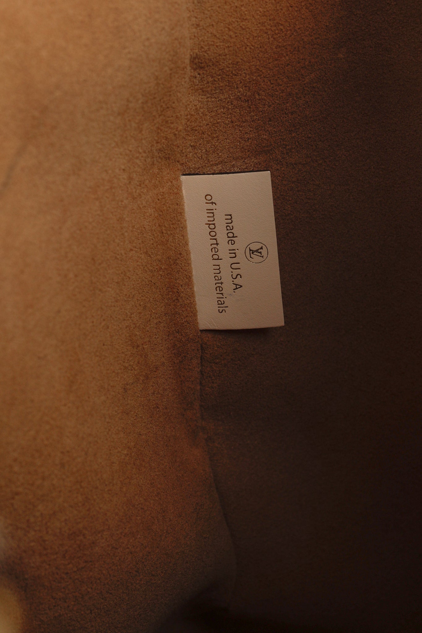 OnTheGo GM Creme Empreinte Monogram Leather Tote Bag