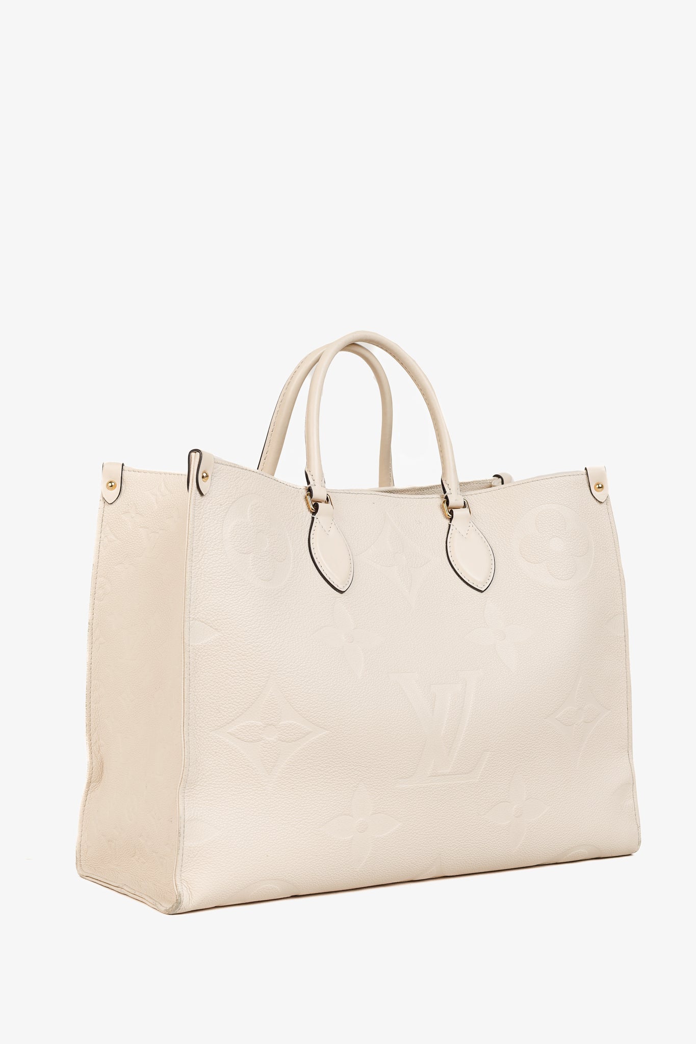OnTheGo GM Creme Empreinte Monogram Leather Tote Bag