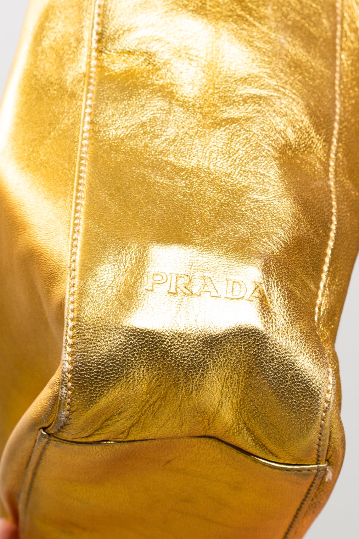 Gold embossed handbag with pink satin interior