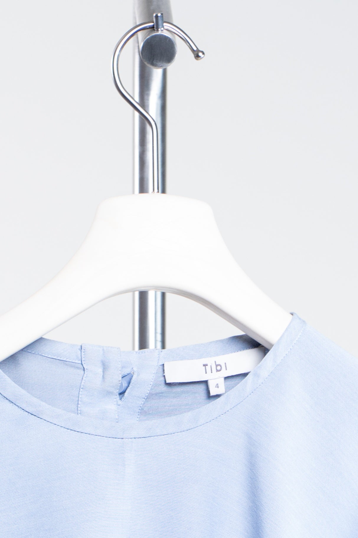 Pale Blue Long Sleeve Asymmetrical Top w/ Button Detail in Back