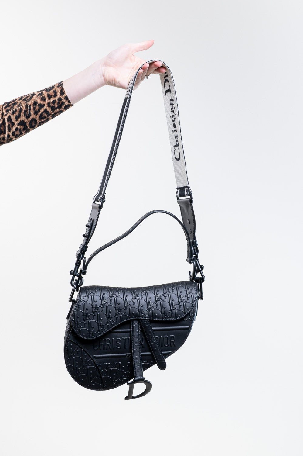Black Oblique Embossed Saddle Bag