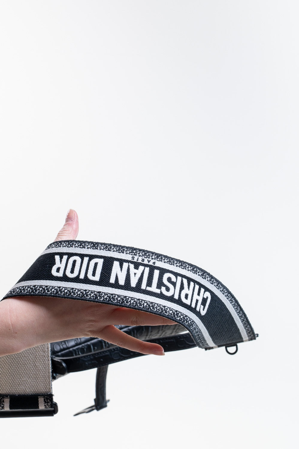 Black Oblique Embossed Saddle Bag