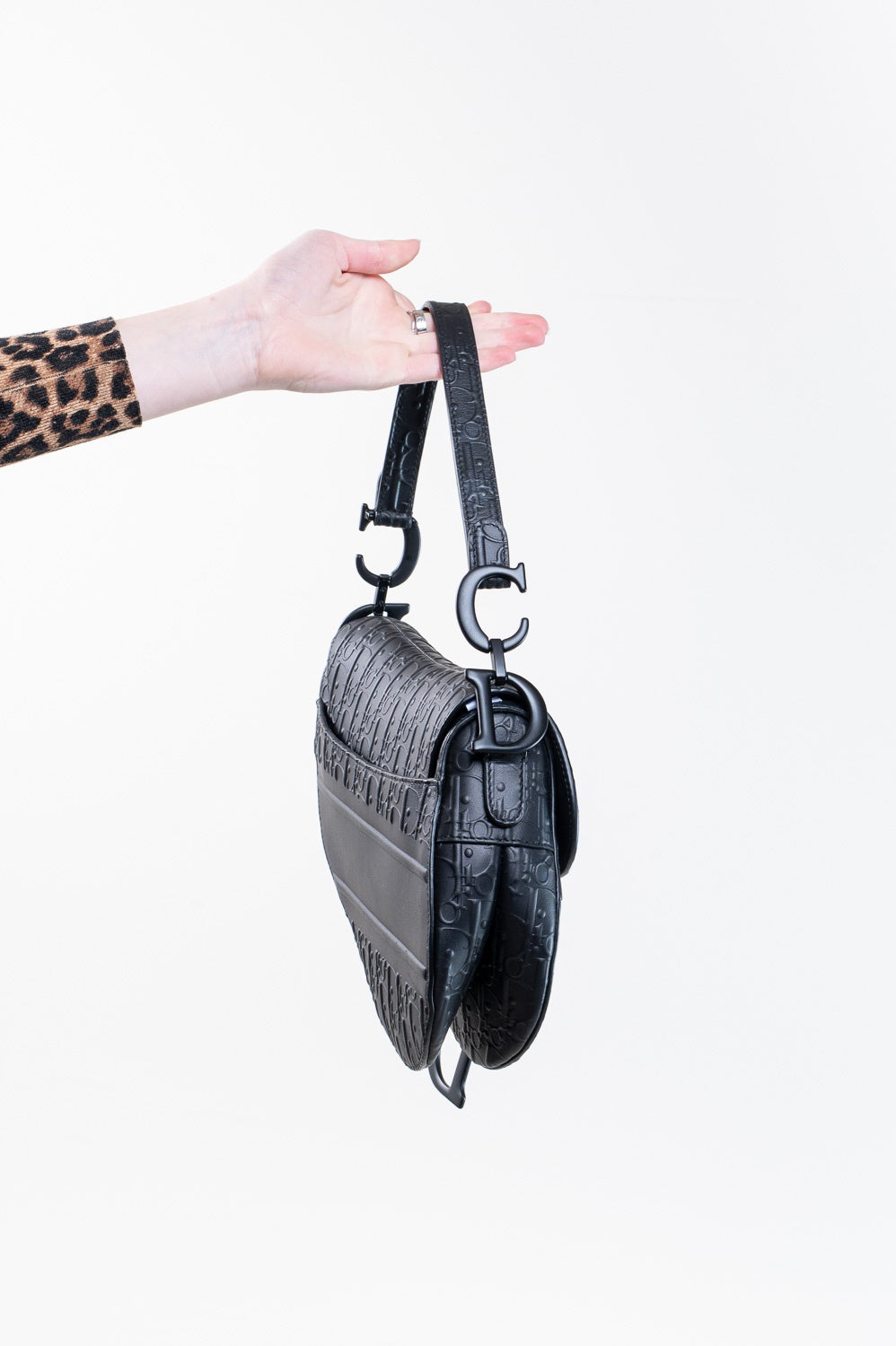 Black Oblique Embossed Saddle Bag