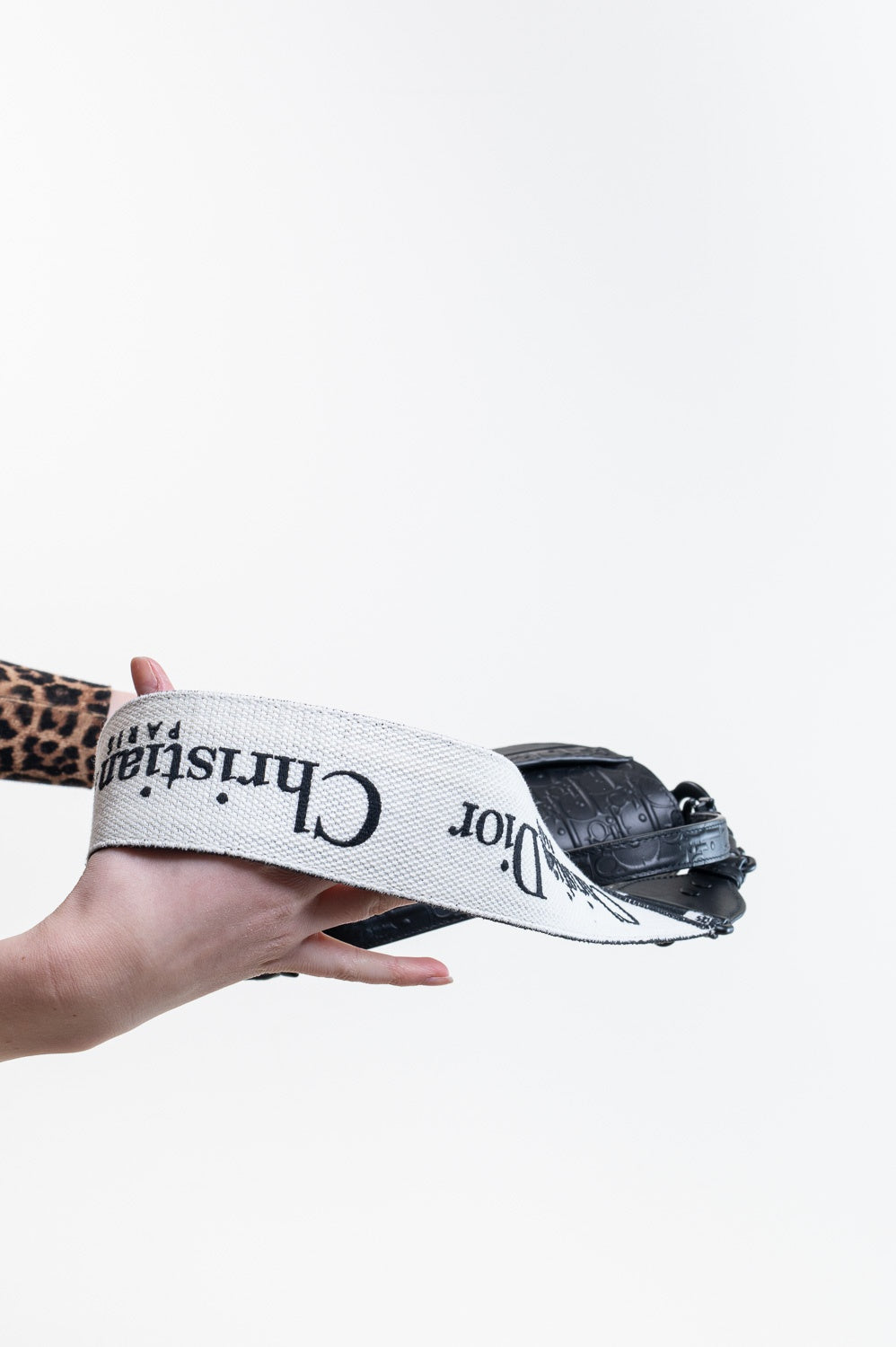 Black Oblique Embossed Saddle Bag