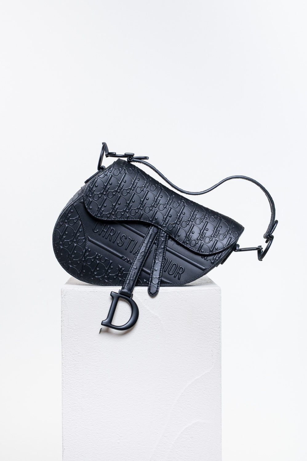 Black Oblique Embossed Saddle Bag
