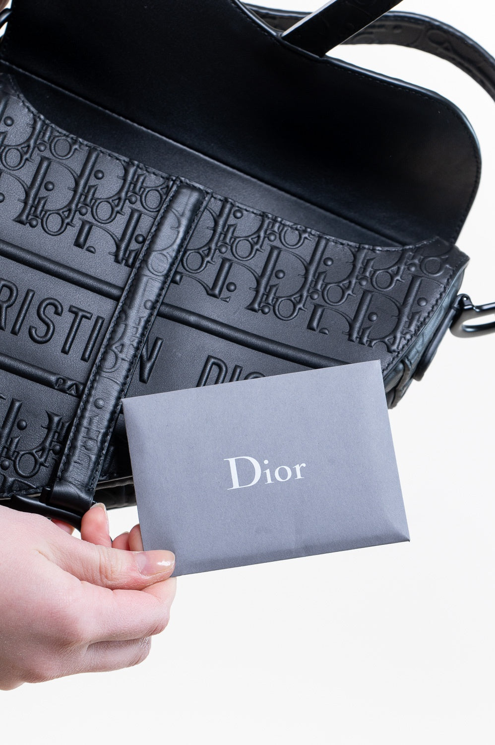 Black Oblique Embossed Saddle Bag