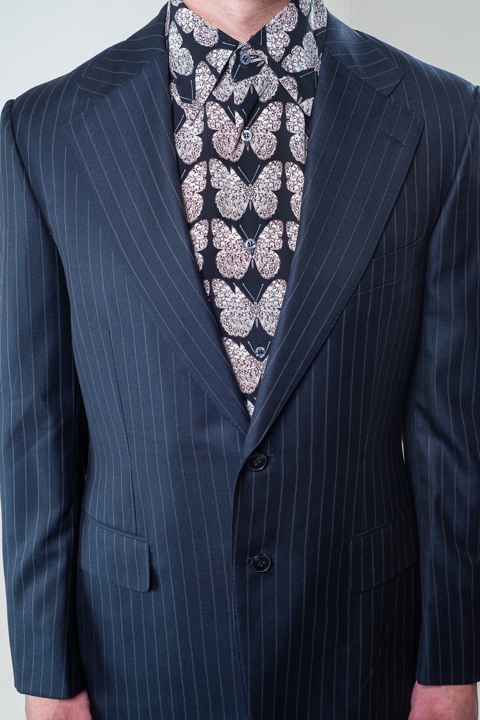 Collar and button detail on Gucci Men's butterfly patterned shirt