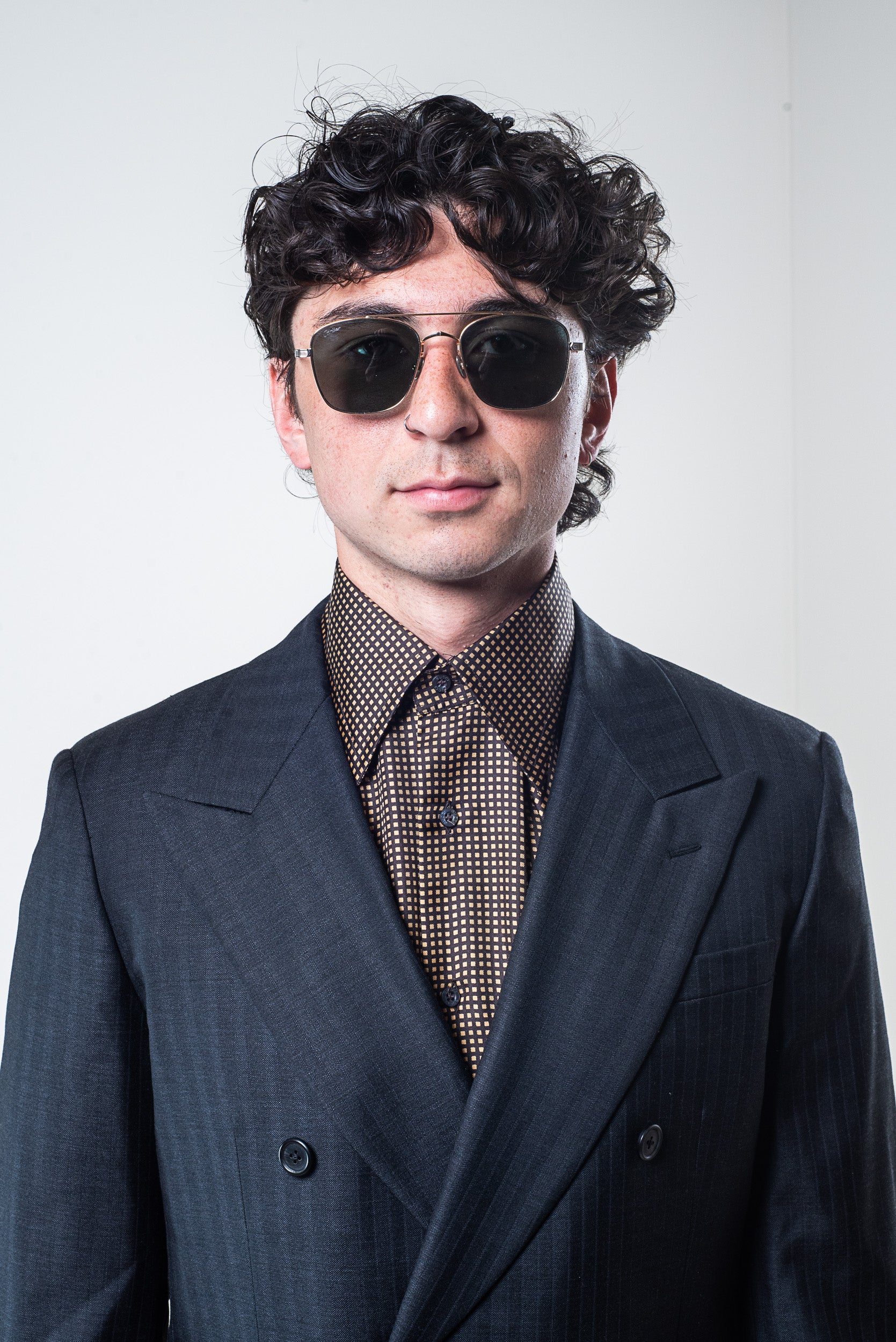 Model wearing Gucci Men’s Yellow and Brown Patterned Silk Button-Down Shirt – front view