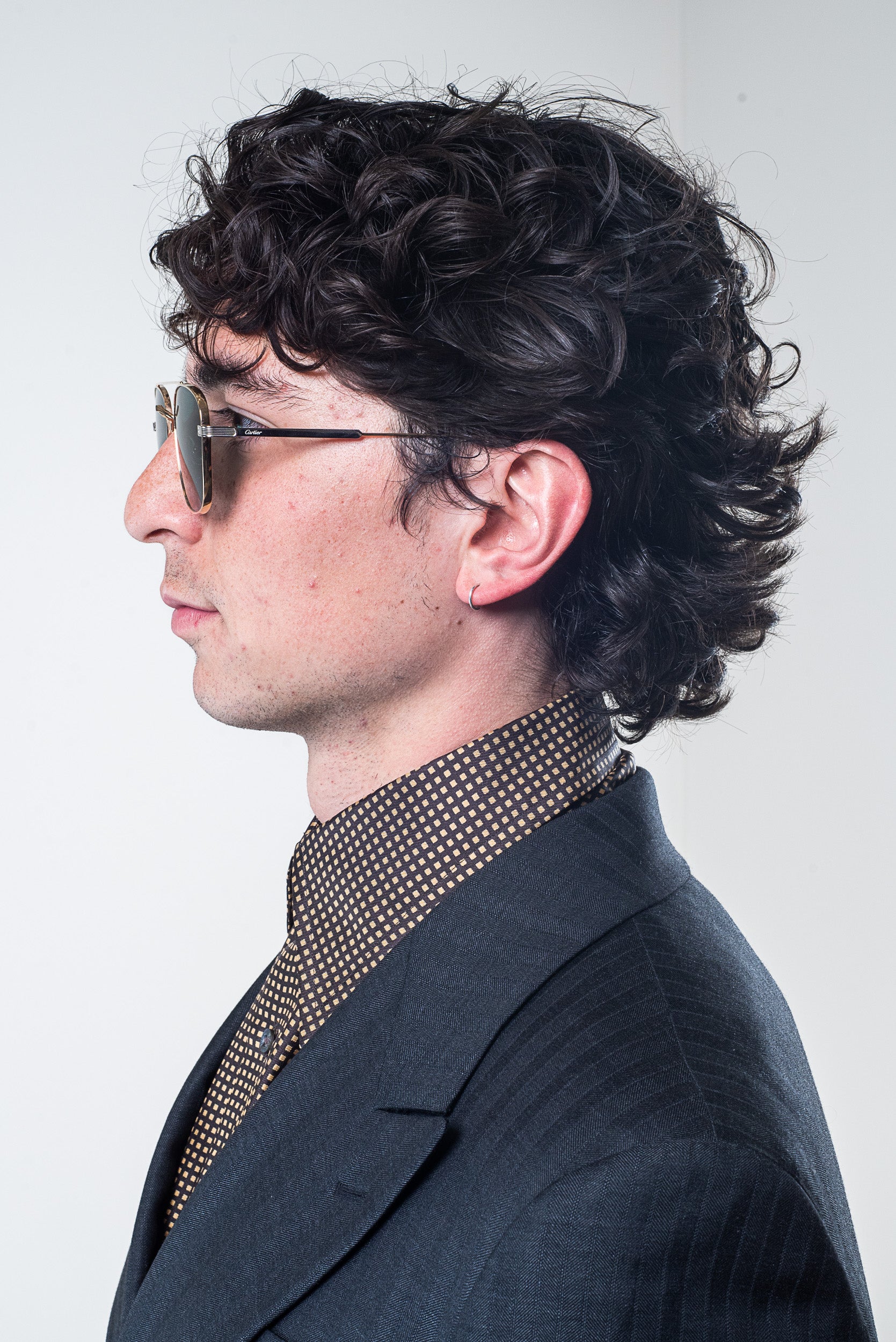 Model wearing Gucci Men’s Yellow and Brown Patterned Silk Button-Down Shirt – side view