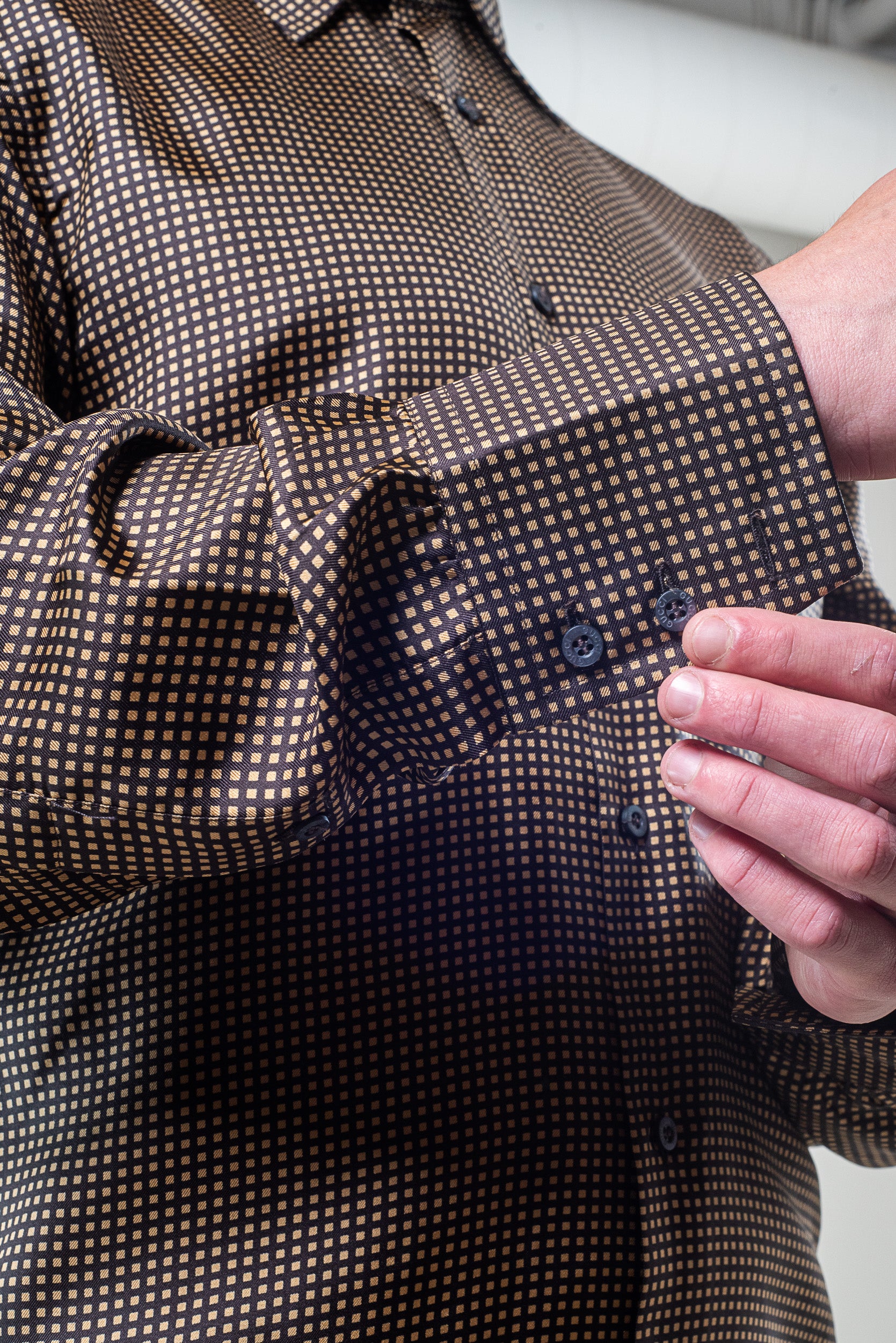 Close-up of Gucci Men’s Yellow and Brown Patterned Silk Shirt fabric and print details