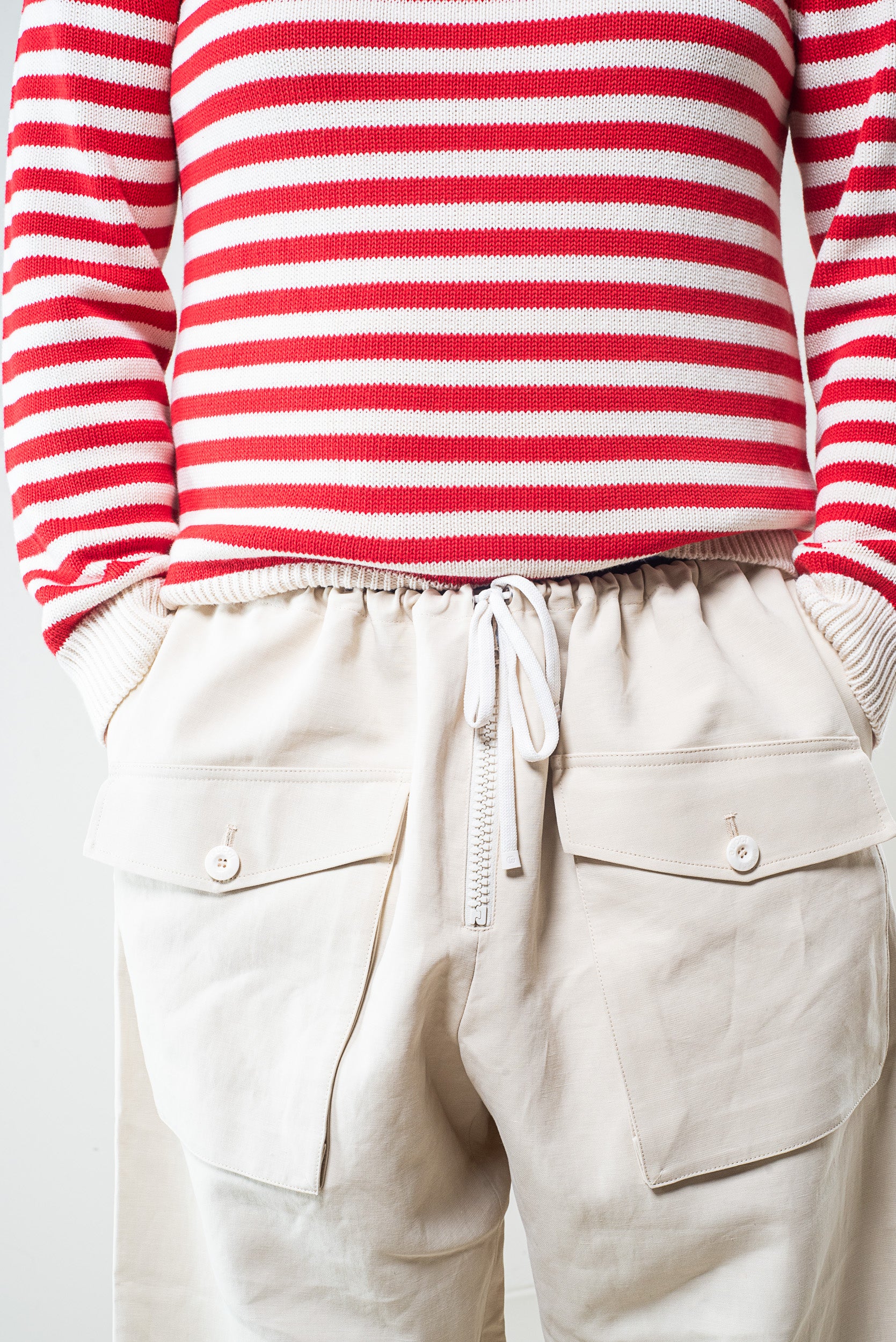 Close-up of drawstring waist on Gucci beige cargo joggers
