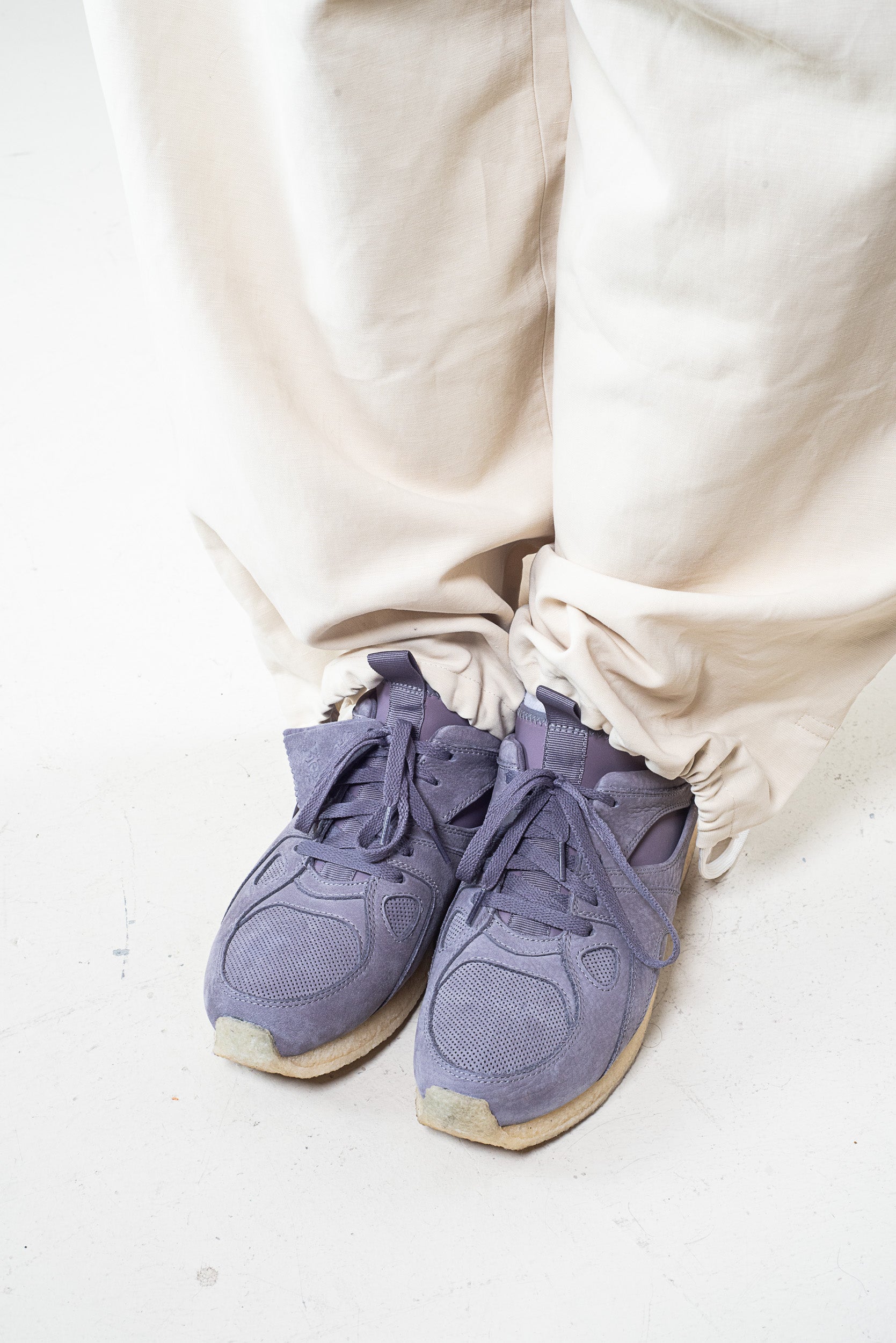 Up view of Ronnie Fieg x Clarks taupe suede Breacon sneakers