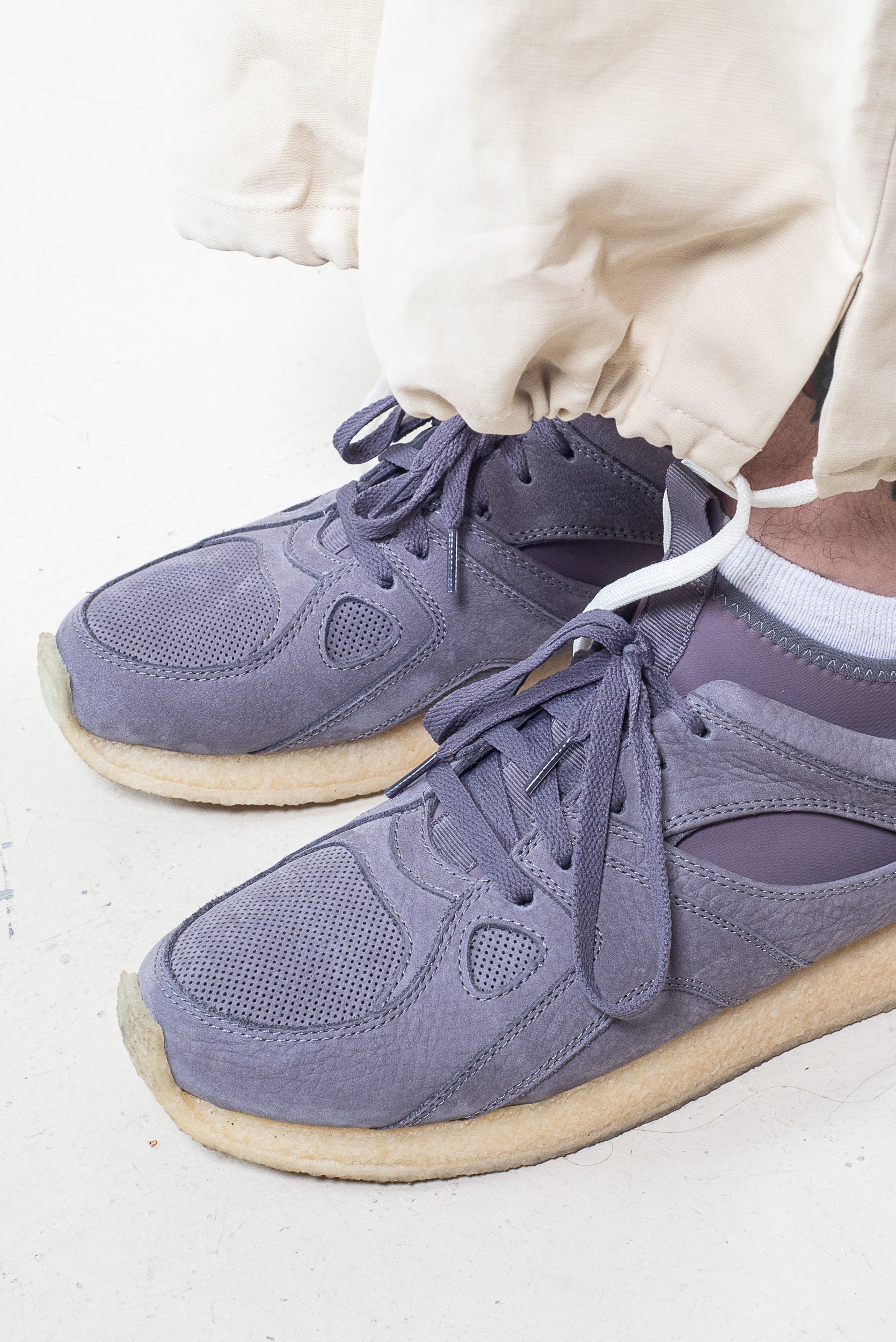 Front view of Ronnie Fieg x Clarks taupe suede Breacon sneakers