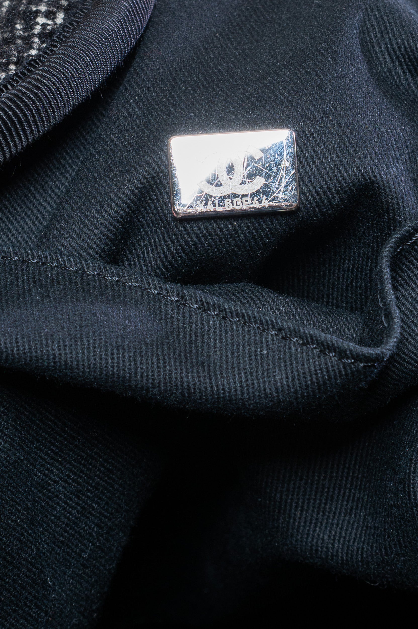 Close-up inside view of Chanel Deauville Black/White Wool Medium Chain Tote