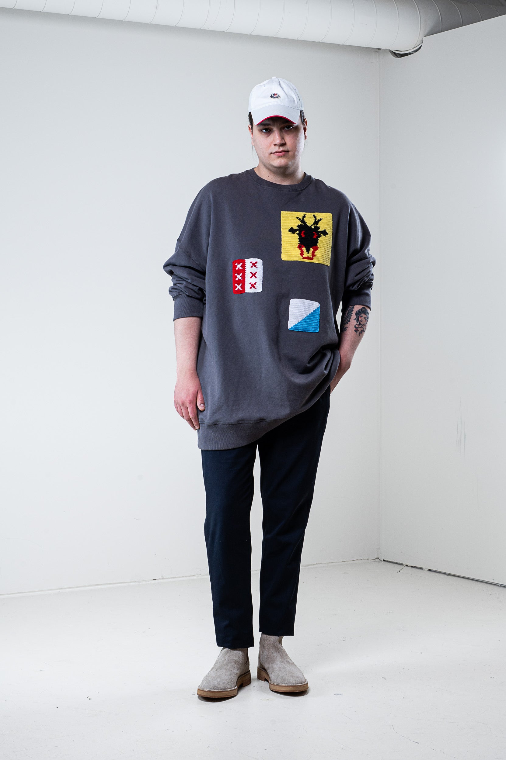 Front view of J.W. Anderson Grey Patch Knit Crew Neck Sweater