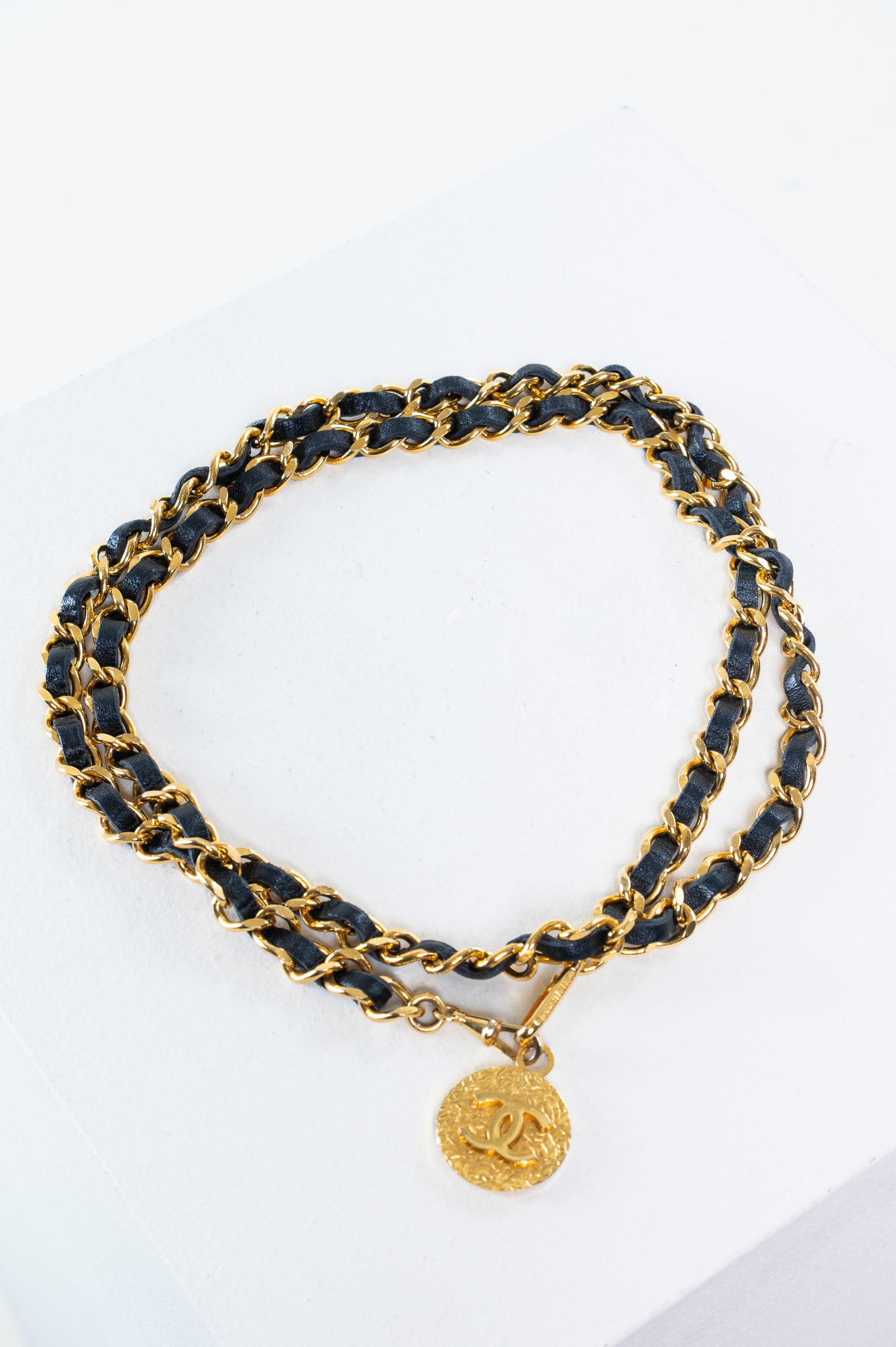 Chanel Vintage Coco Chain Medallion Belt in black leather and gold-tone chain with medallion charm
