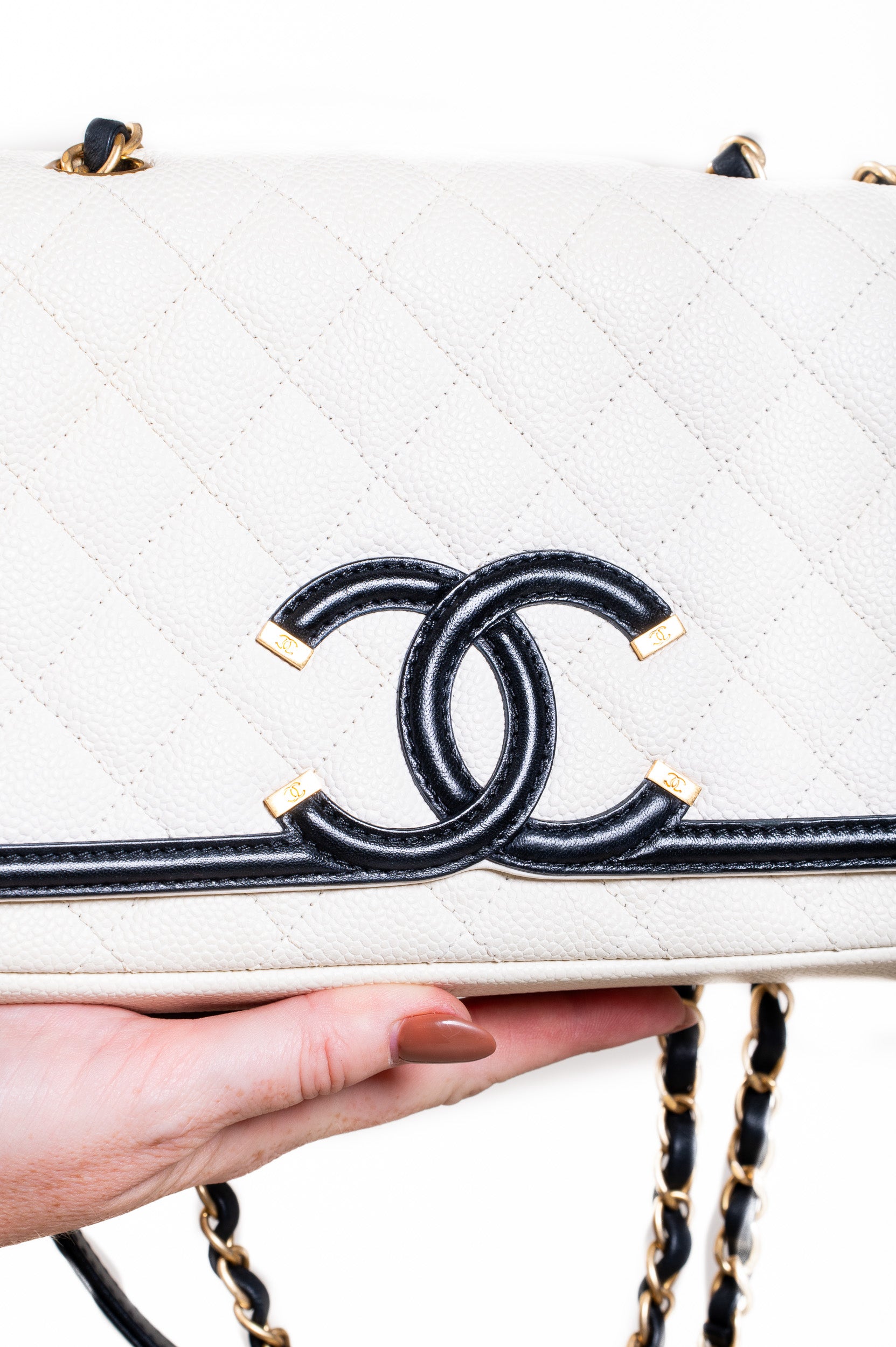 Close-up front view of Chanel Medium Caviar CC Filigree Flap Bag