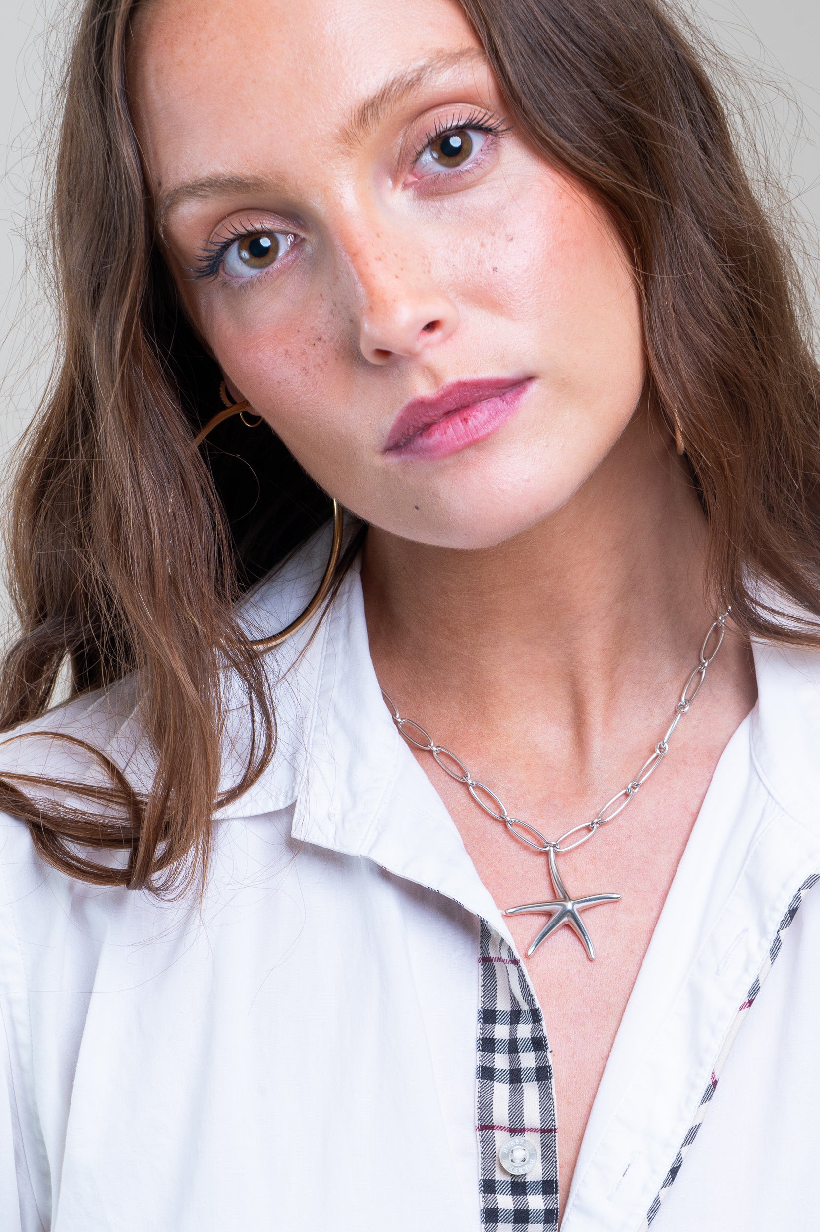 Model wearing Tiffany & Co. Starfish Pendant on Paperclip Chain
