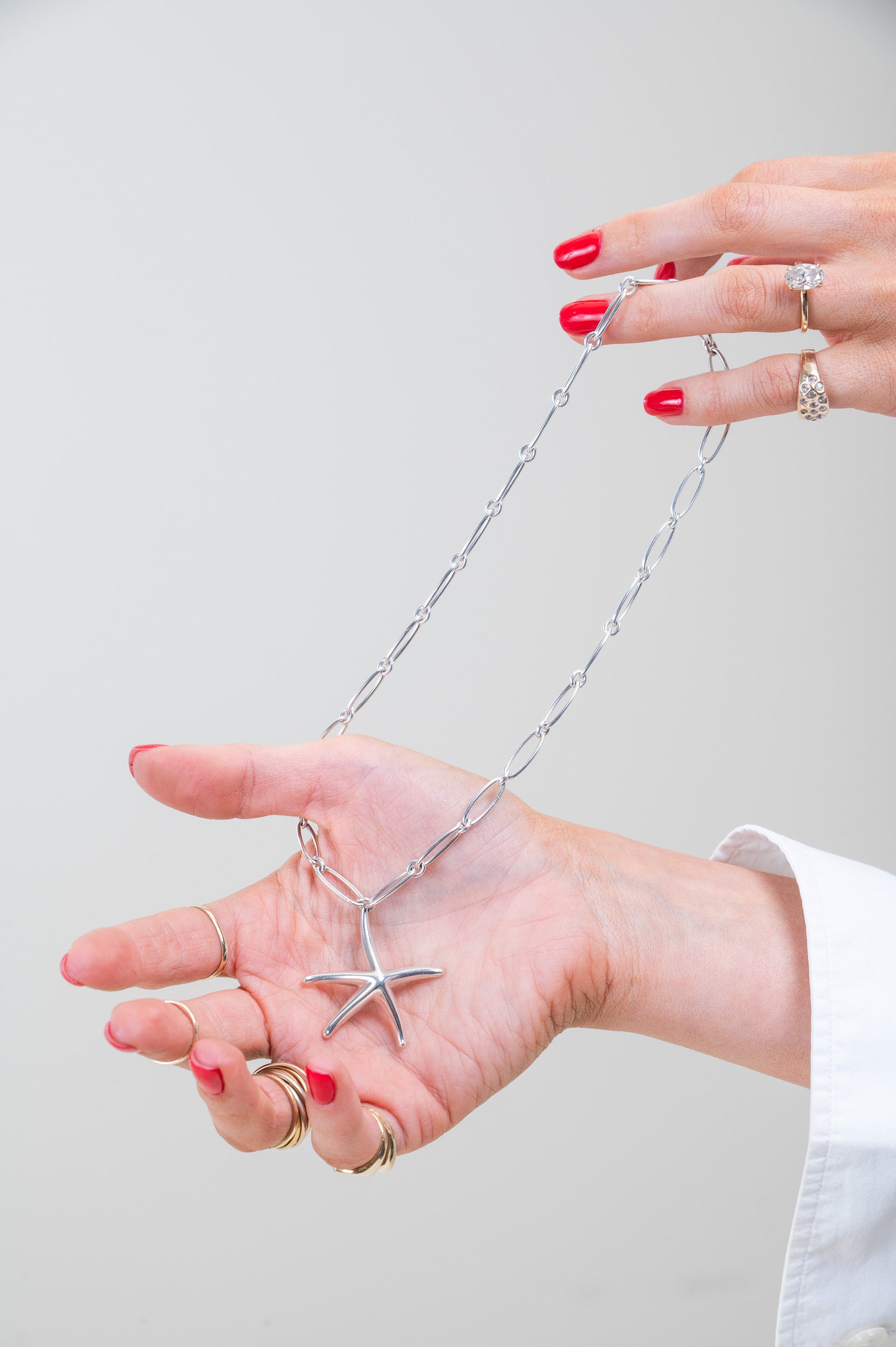 Front view of Tiffany & Co. Starfish Pendant on Paperclip Chain