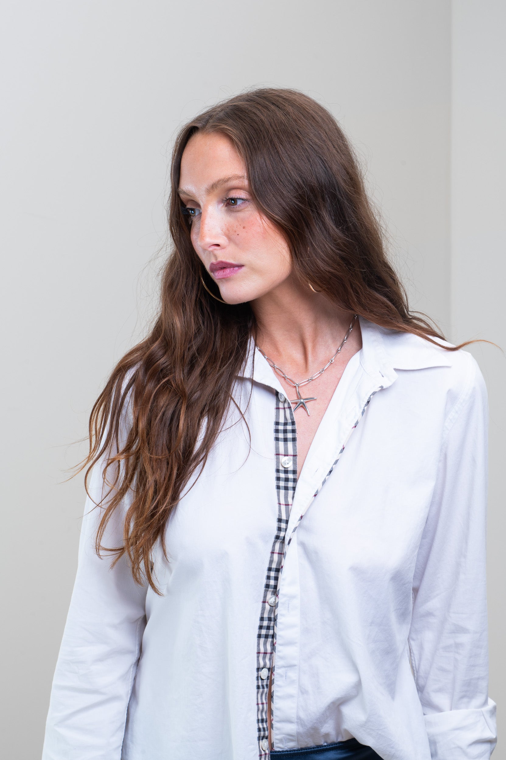 Model showcasing Tiffany & Co. Starfish Pendant on Paperclip Chain