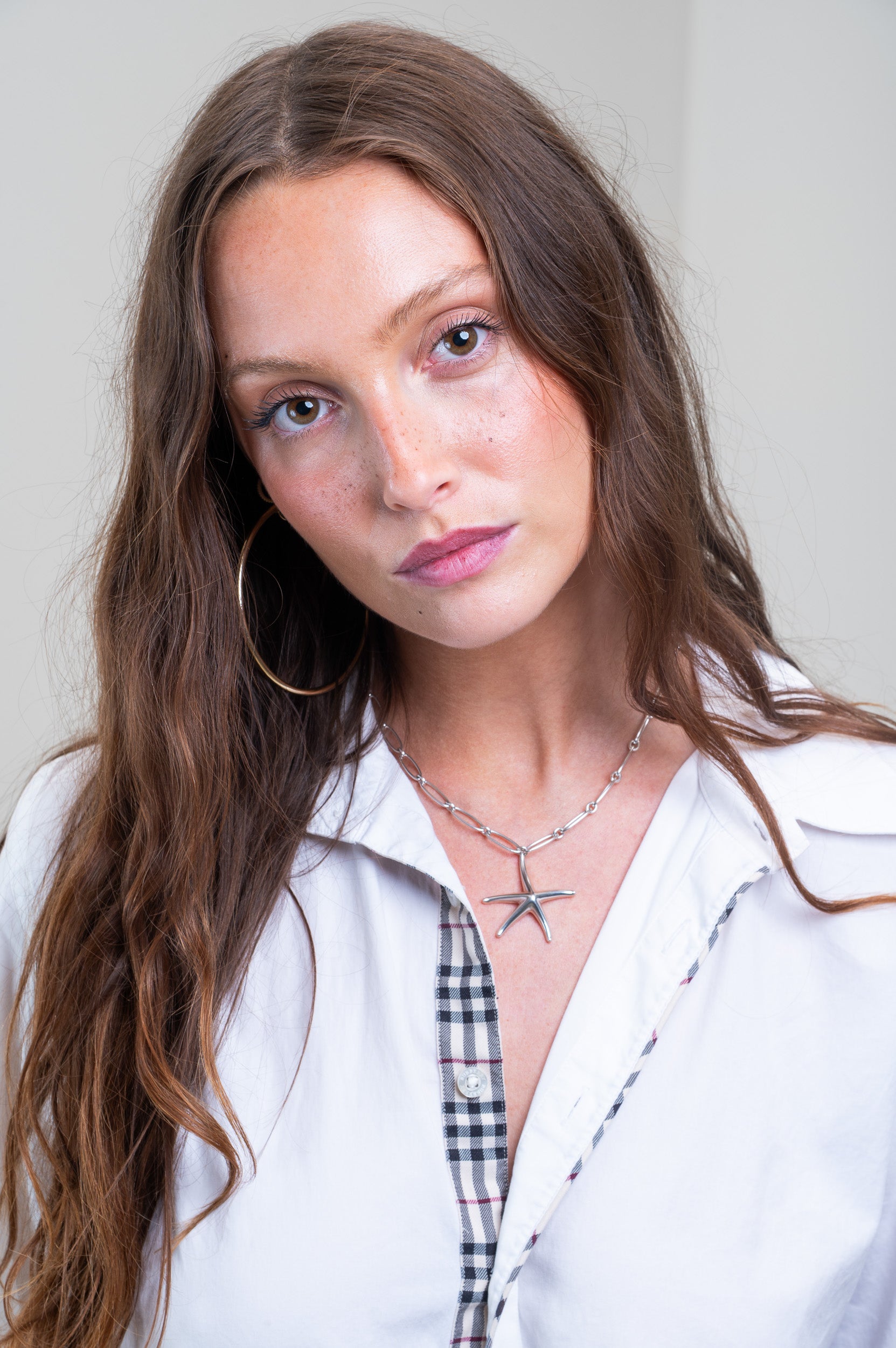 Model showcasing Tiffany & Co. Paperclip Chain with Starfish Pendant