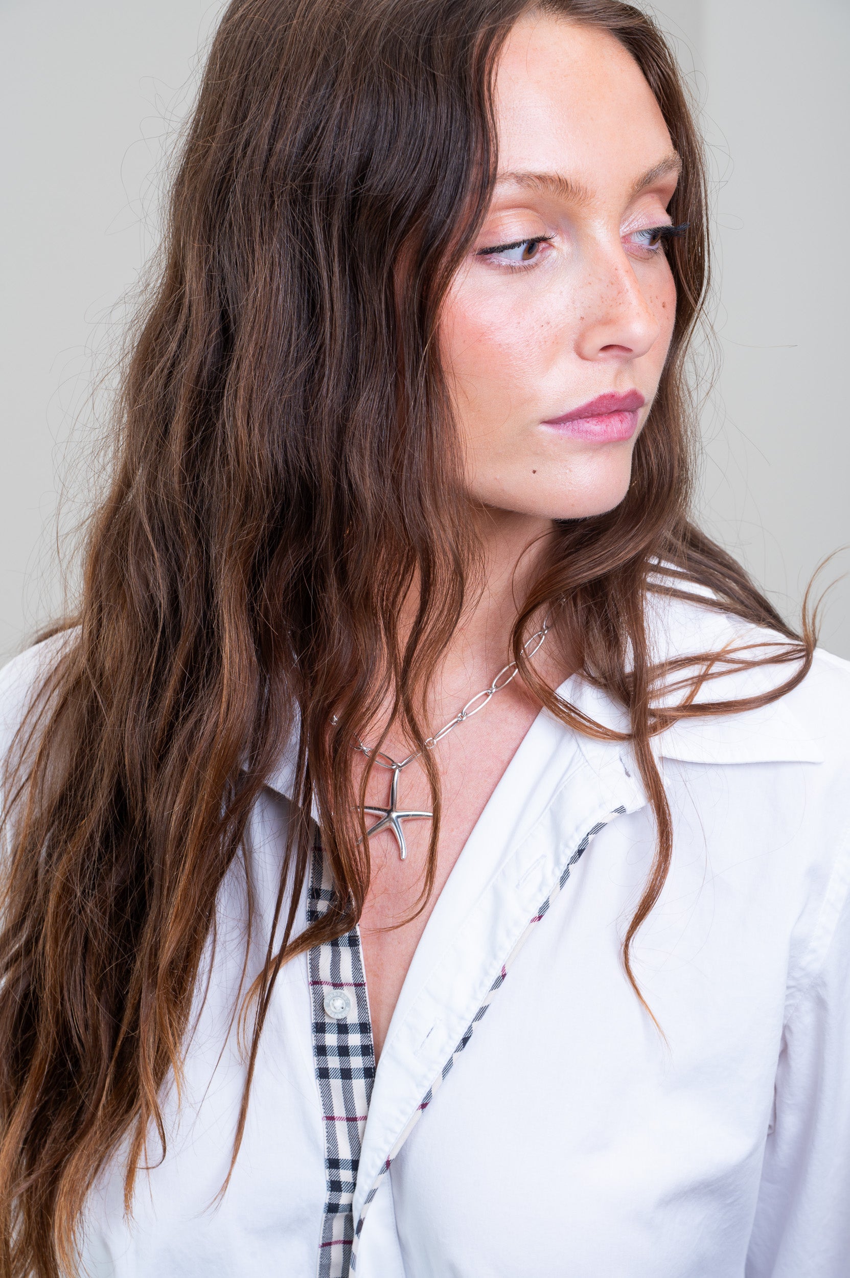 Model showcasing Tiffany & Co. Starfish Pendant on silver chain