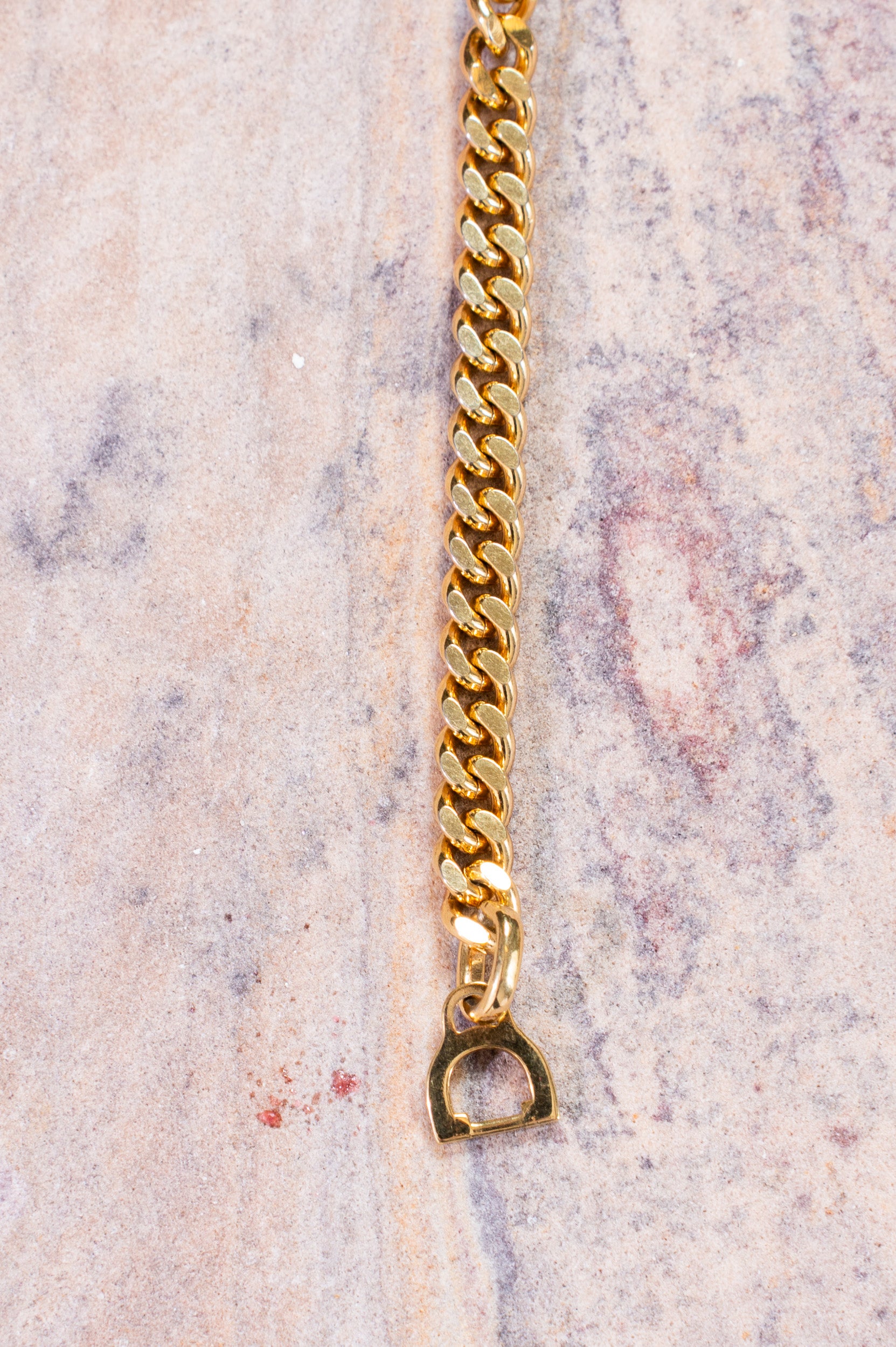 Close-up view of Christian Dior Gold Crystal CD Chain Bracelet