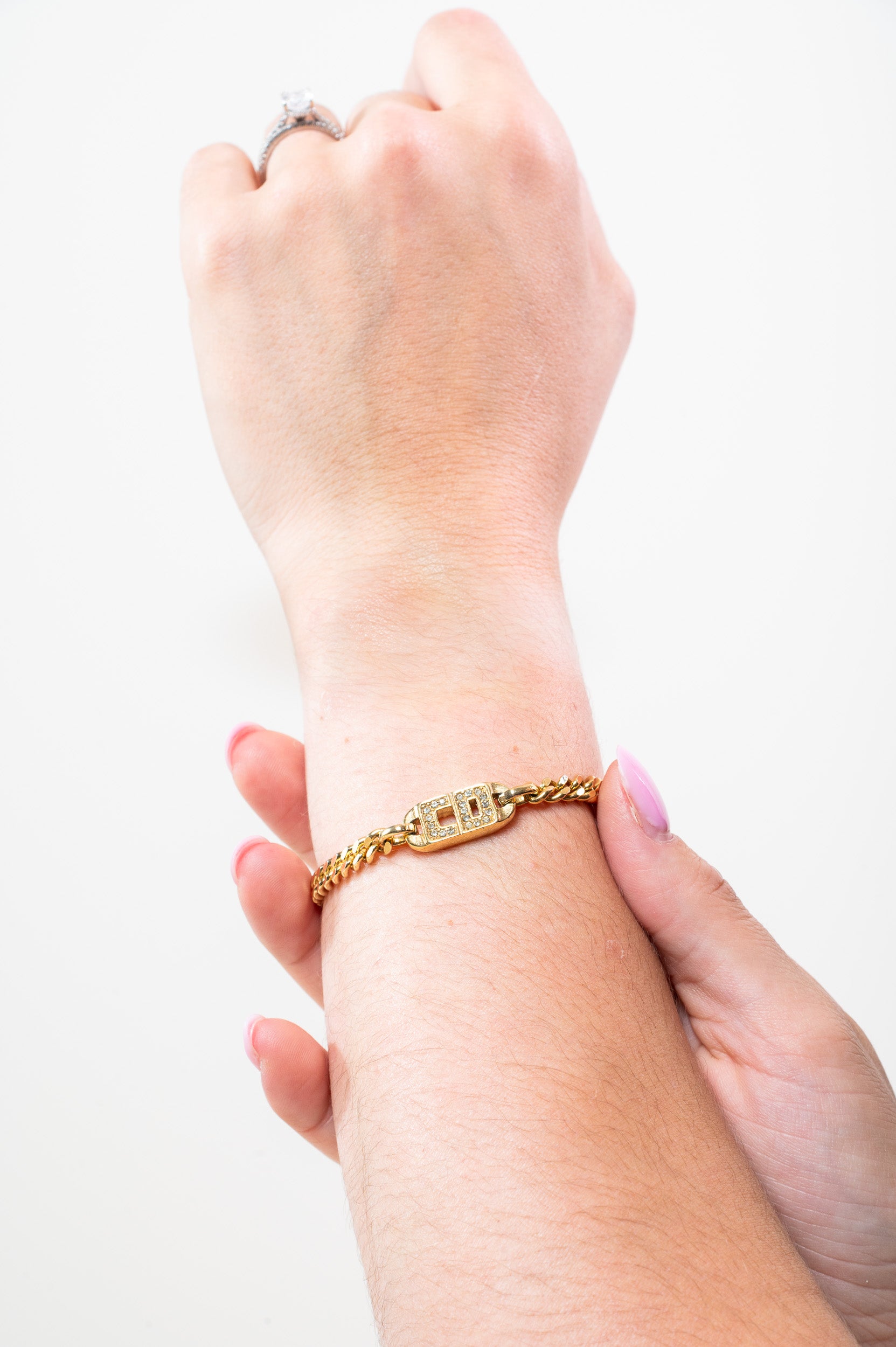 Christian Dior Gold Crystal CD Chain Bracelet worn on wrist