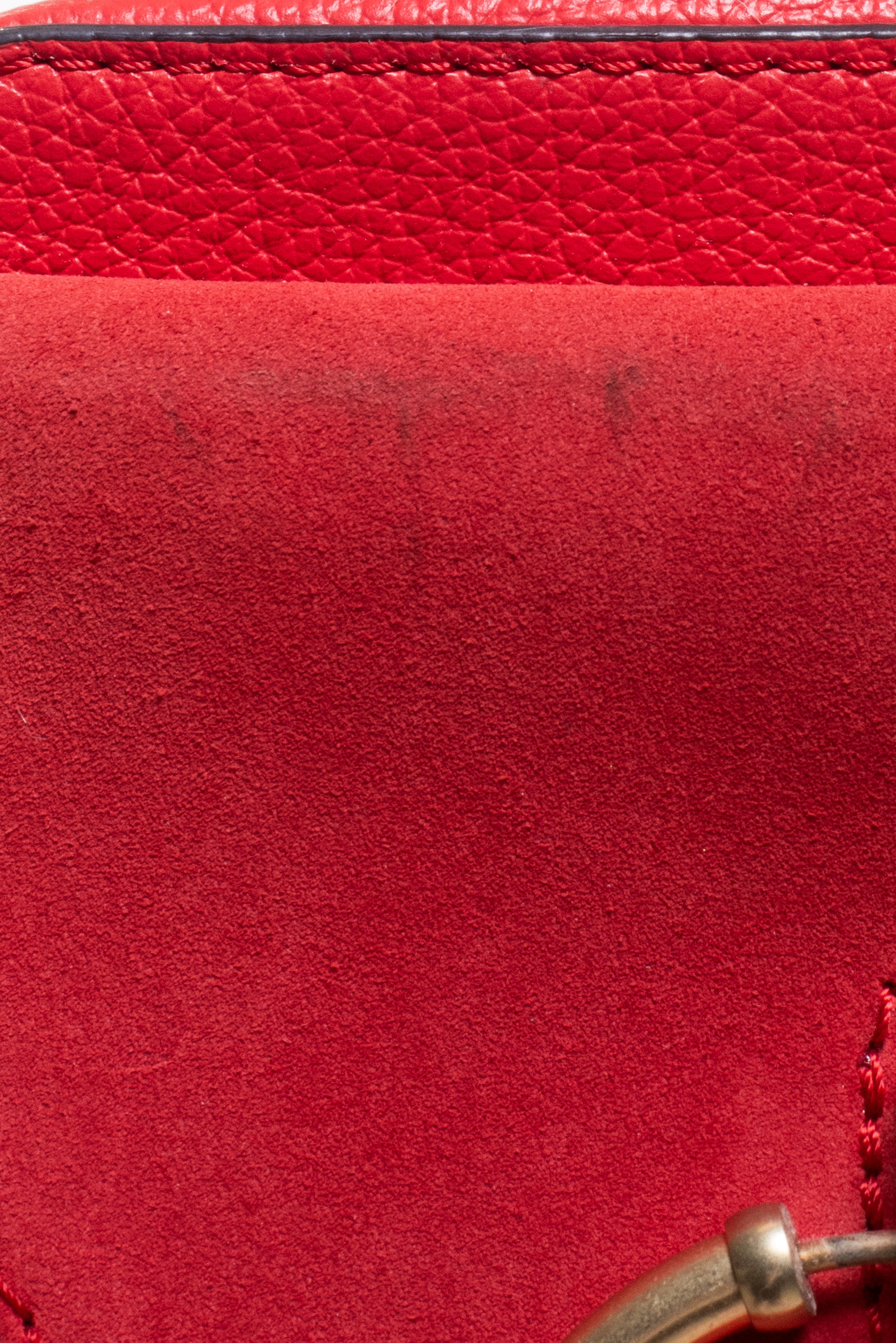 Additional close-up of red suede flap detail on See by Chloé Small Red Joan Crossbody