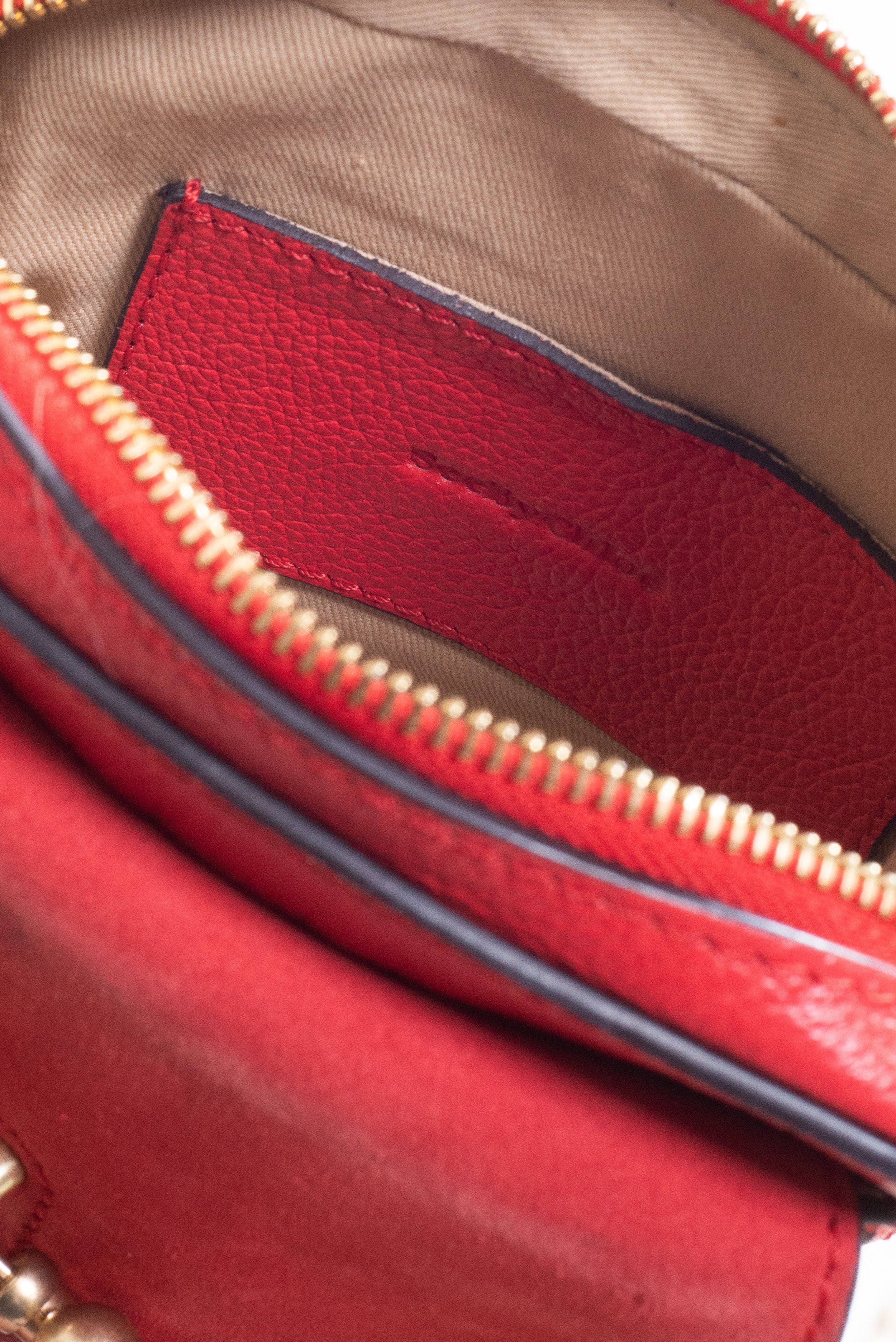 Open view of the interior compartment of See by Chloé Small Red Joan Crossbody