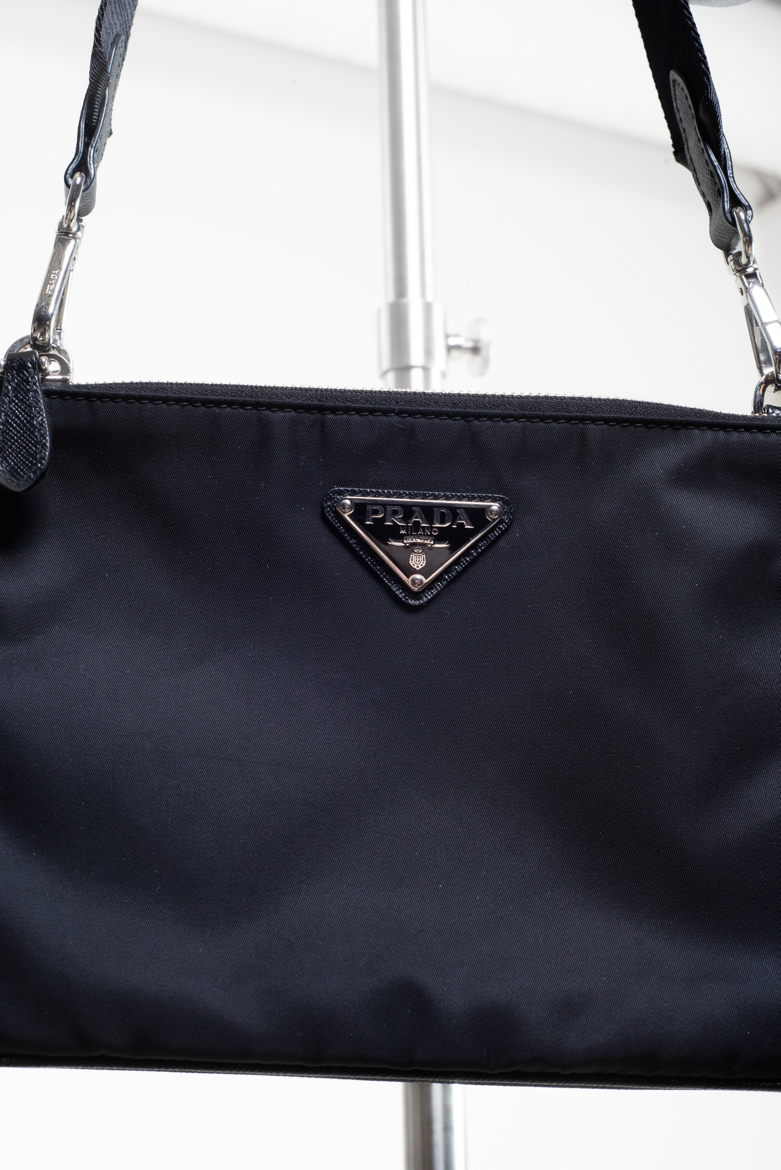 Close-up front view of Prada Black Re-Nylon and Saffiano Crossbody Bag