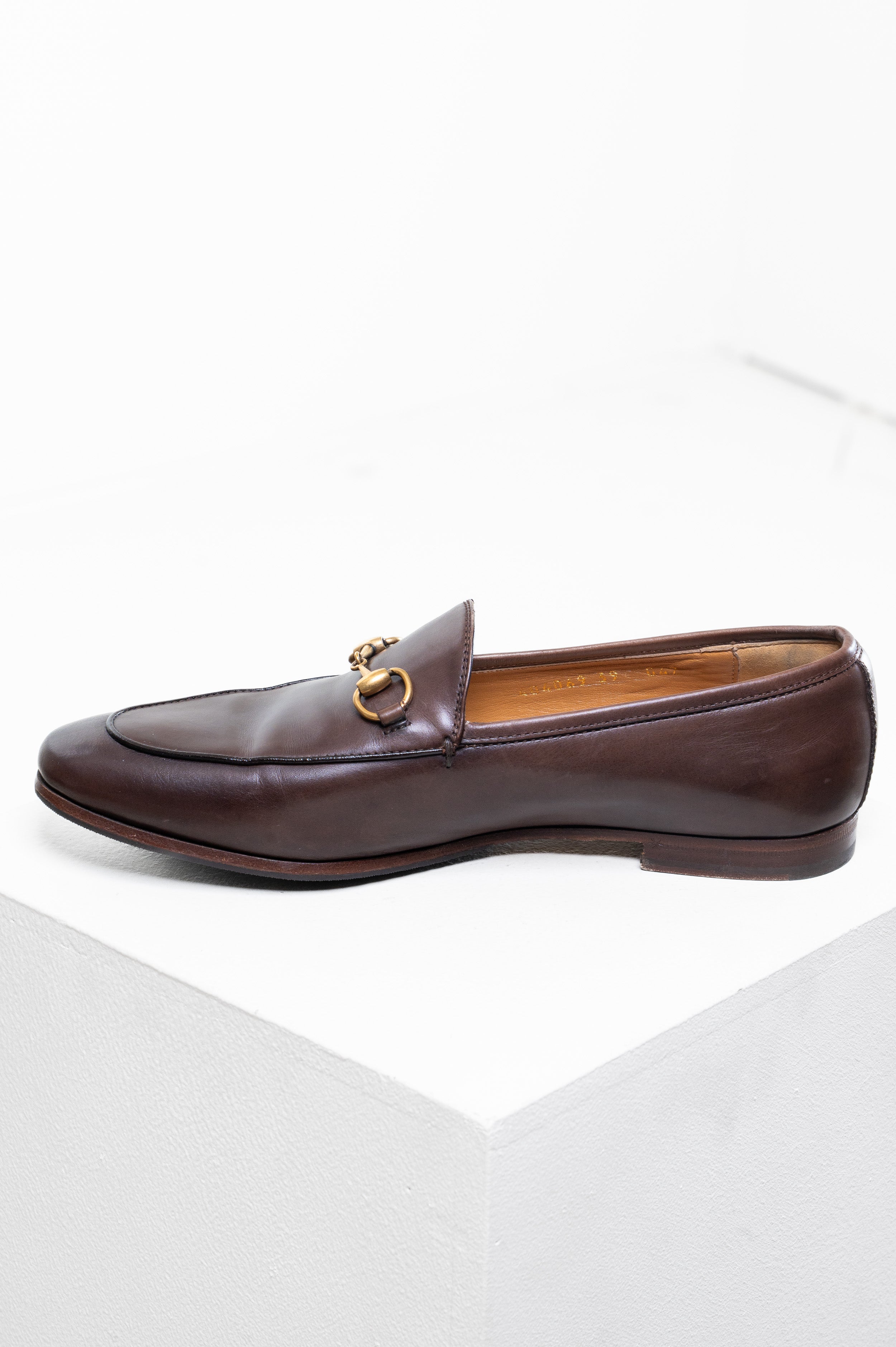 Side profile of Gucci Jordaan Loafer in brown leather