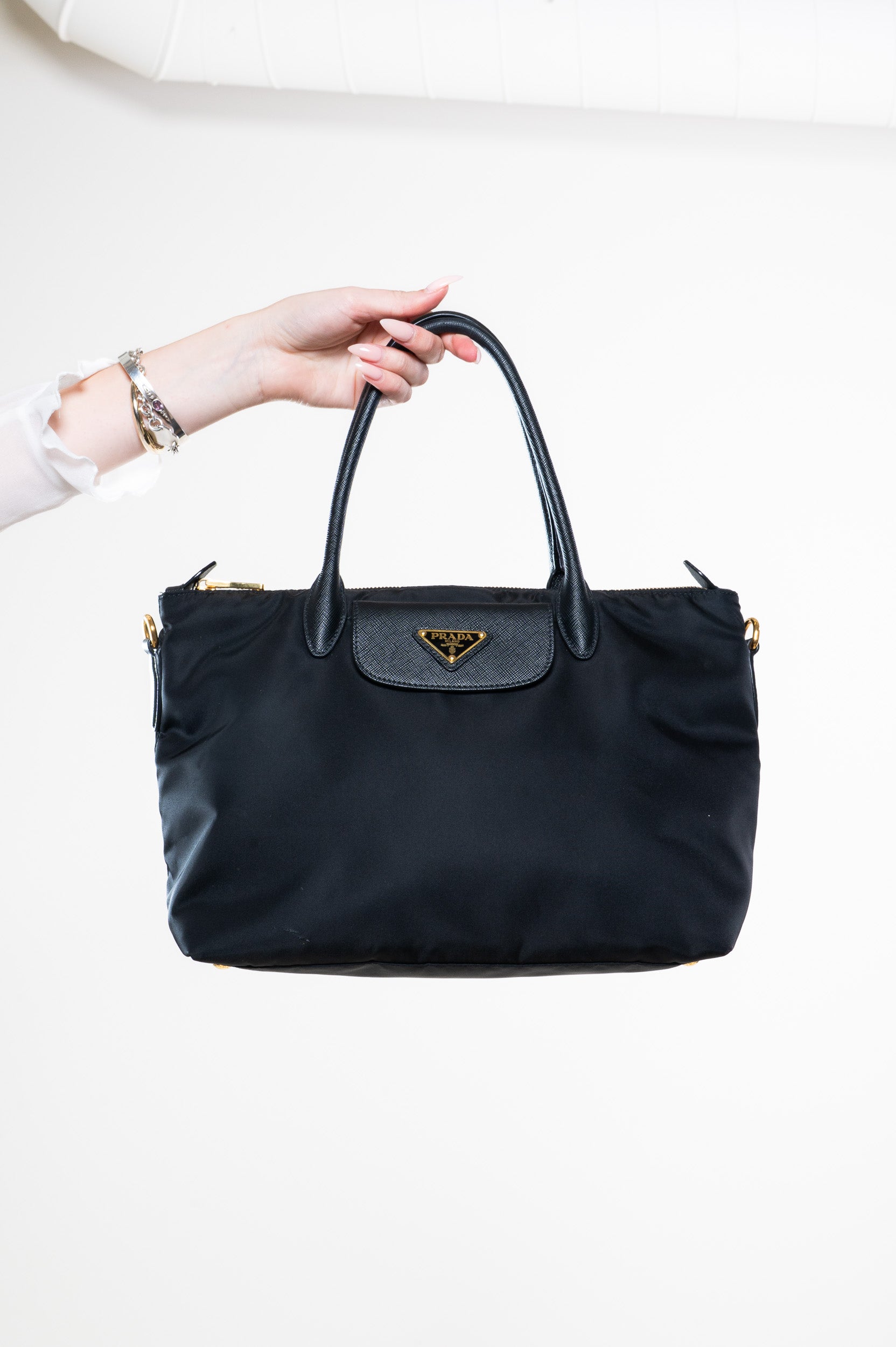 nylon black triangle logo bag