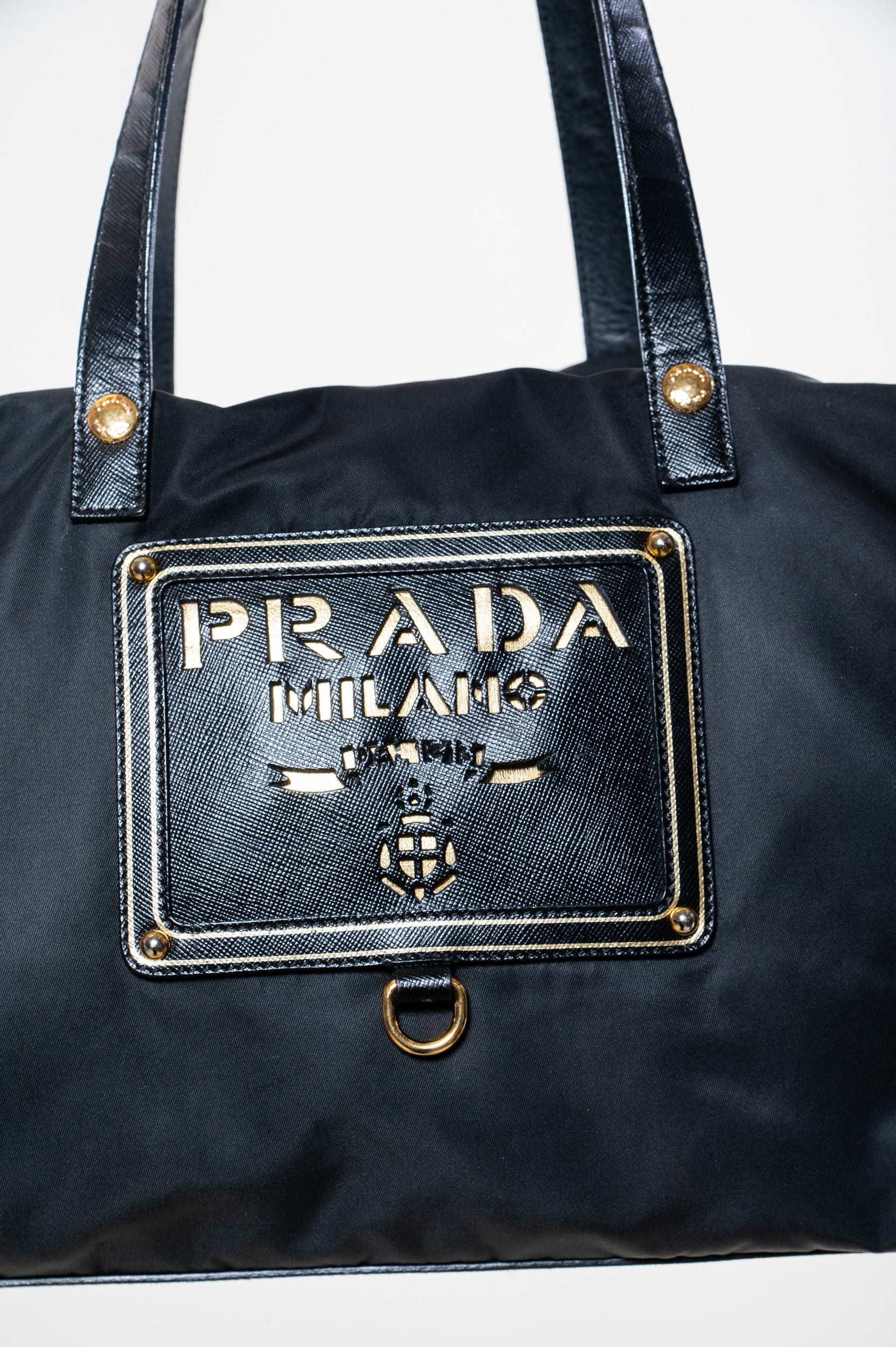 Close-up front view of Prada Nylon Black Perforated Logo Bag