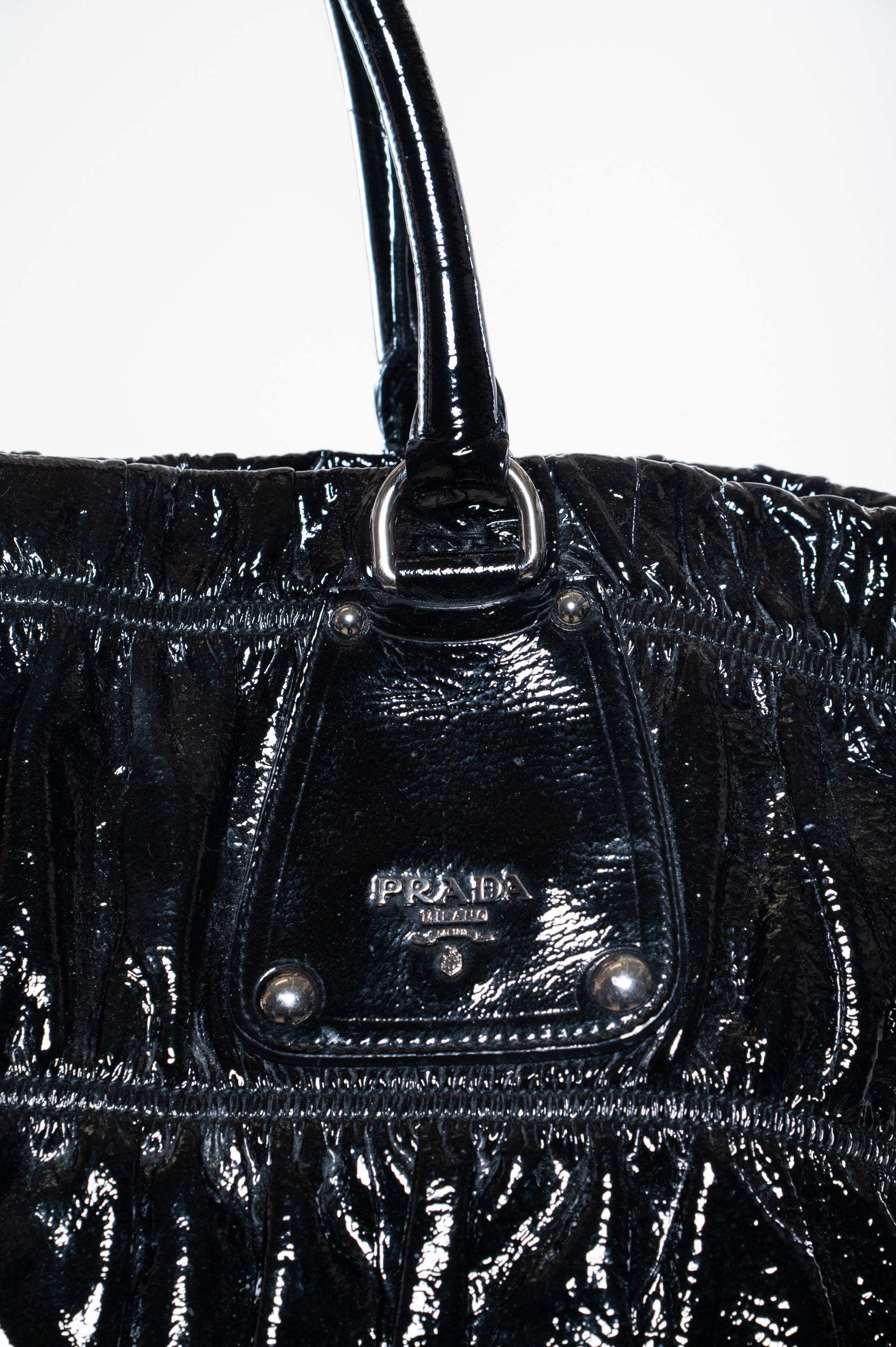 Close-up view of Prada Patent Gauffre Leather Tote Bag