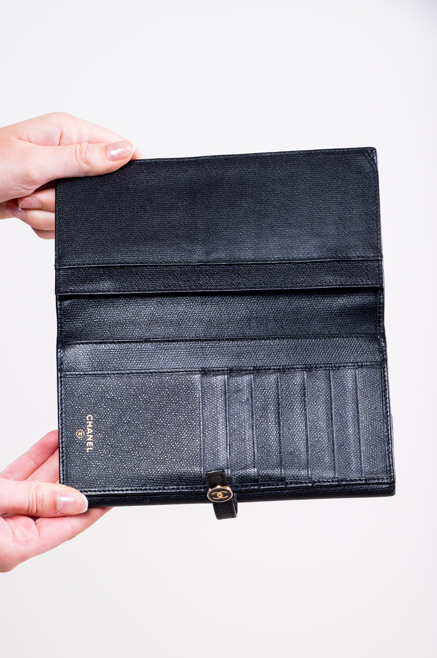 Inside view of Chanel Caviar Skin Coco Button Long Wallet in black leather