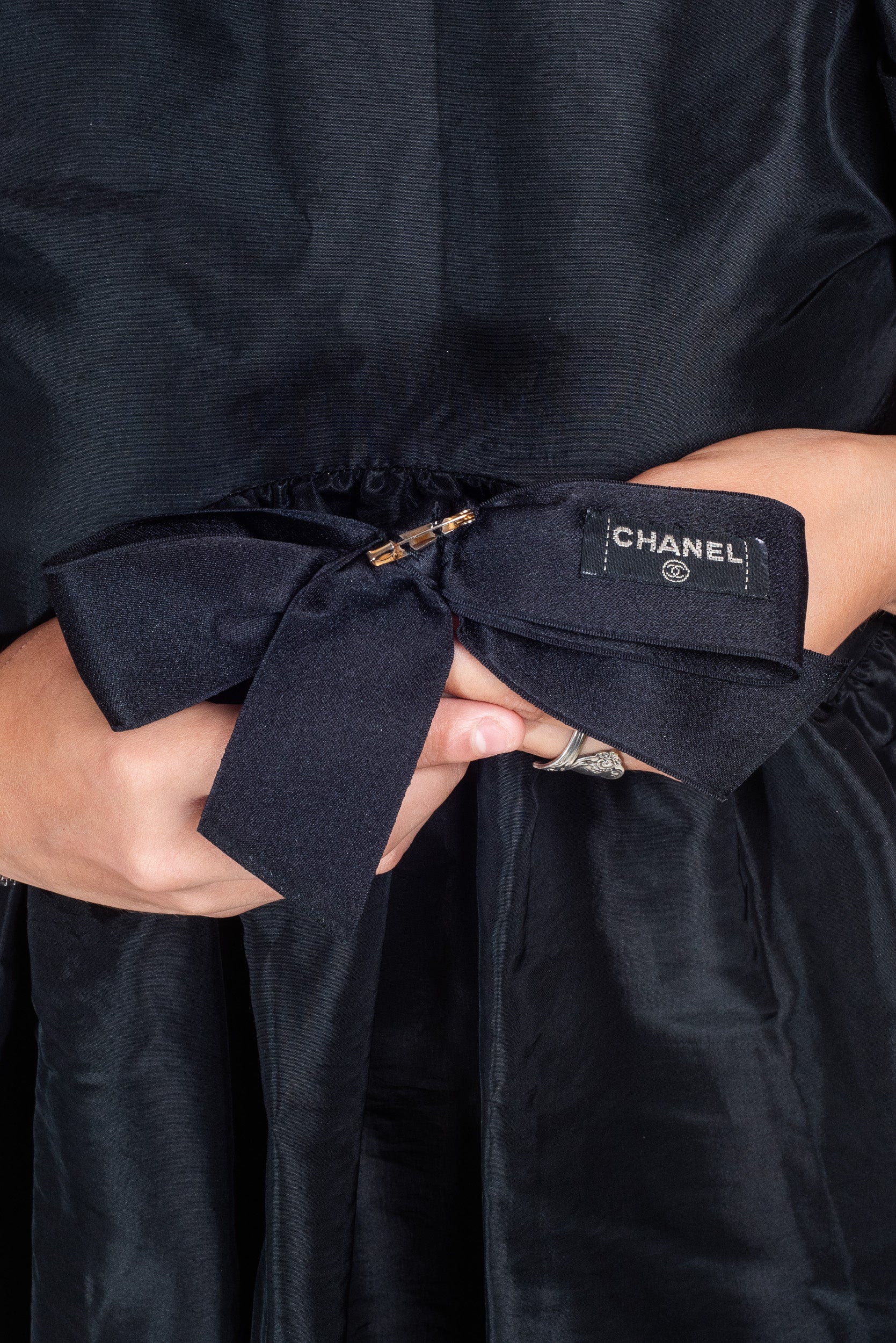 Back view of Chanel Black Ribbon Bow with Gold CC Pin