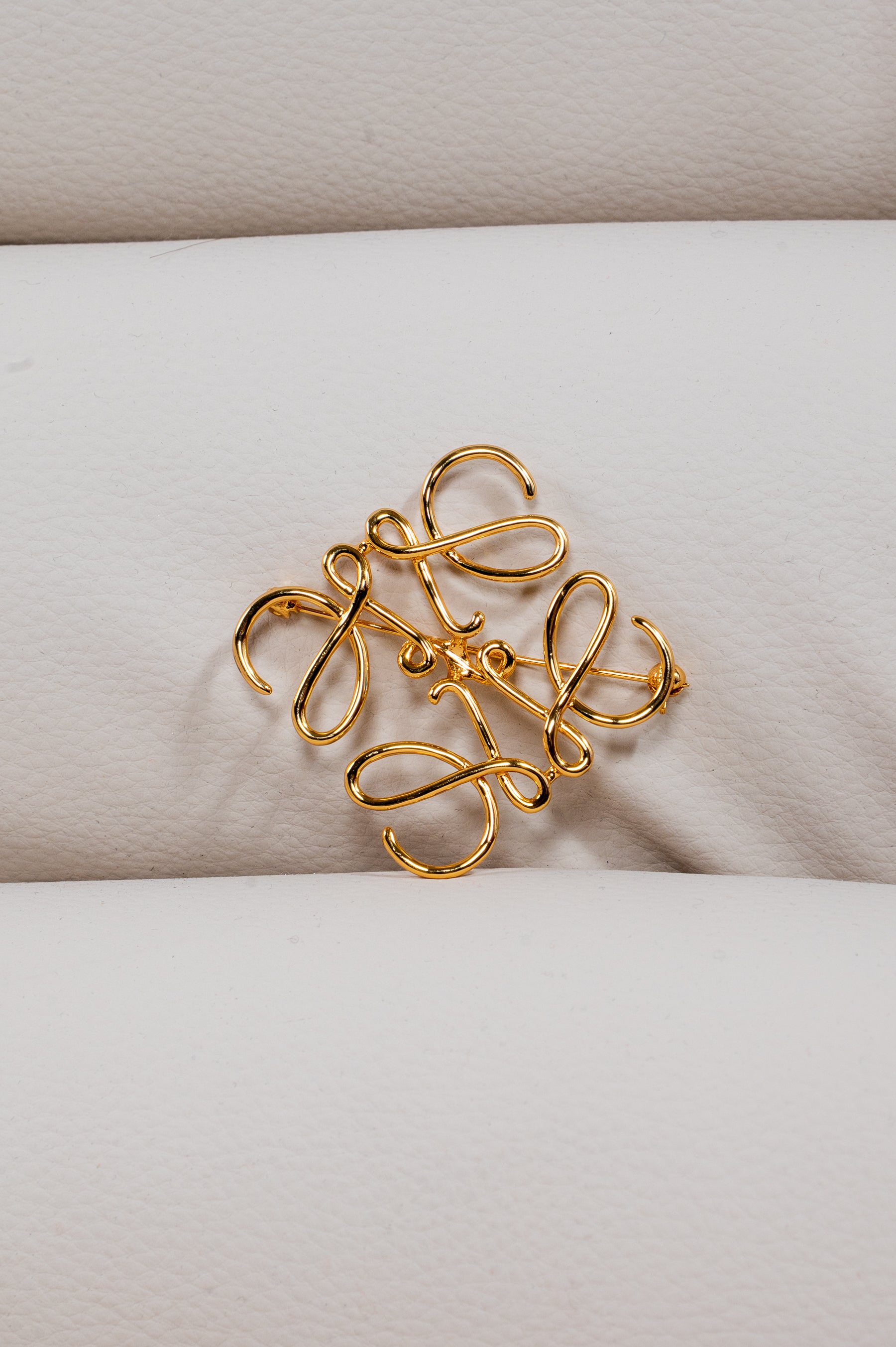 Gold Anagram Metal Brooch