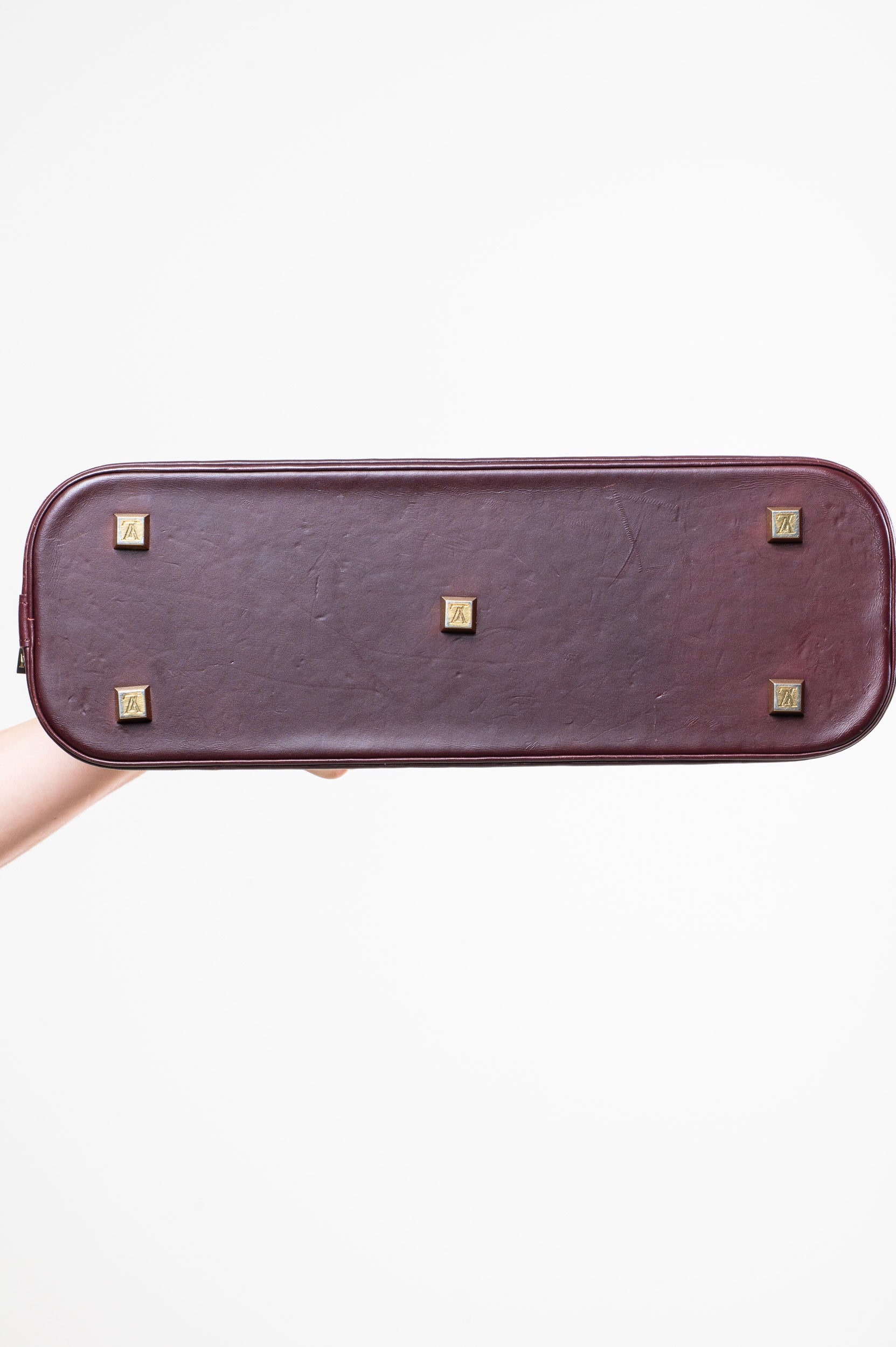 Bottom view of Louis Vuitton Vintage Monogram Mini Lin Horizontal Alma Long Bag