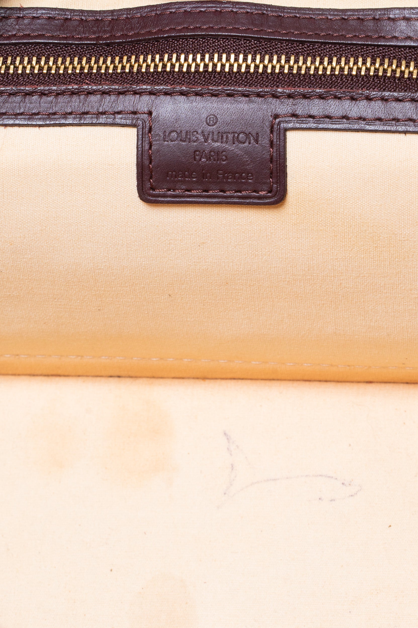 Close-up interior view of Louis Vuitton Vintage Monogram Mini Lin Horizontal Alma Long Bag