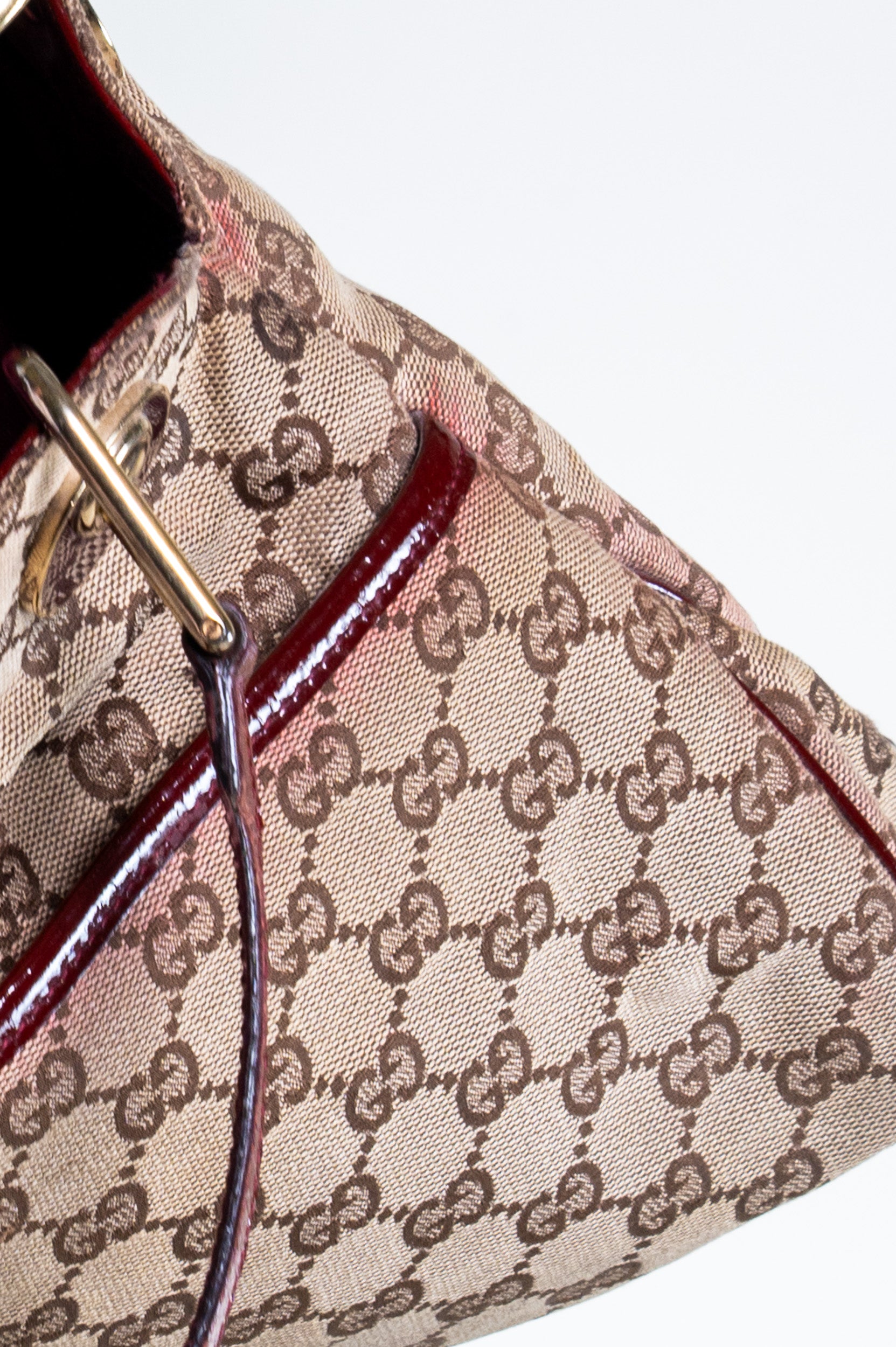 Close-up details of Gucci Monogram Canvas Shoulder Bag