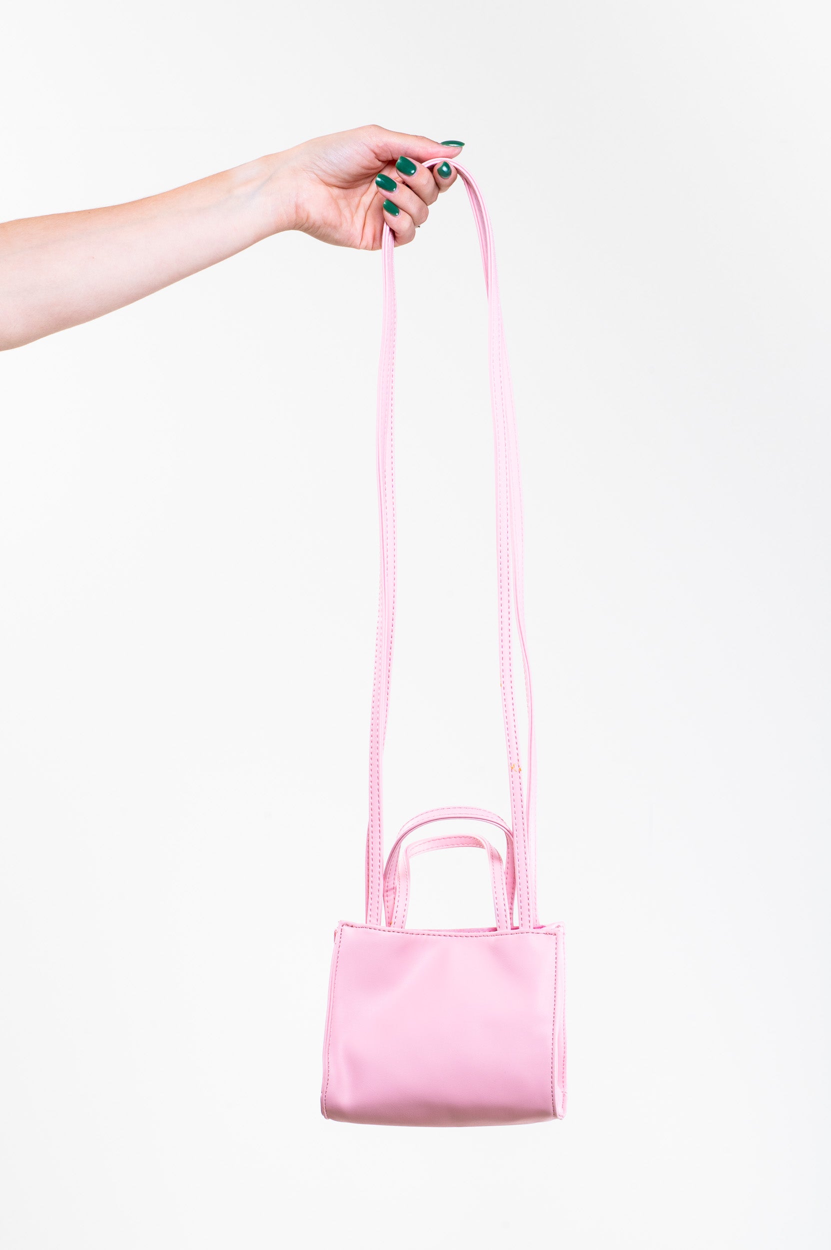 Back view of Telfar Powder Pink Vegan Leather Crossbody Bag