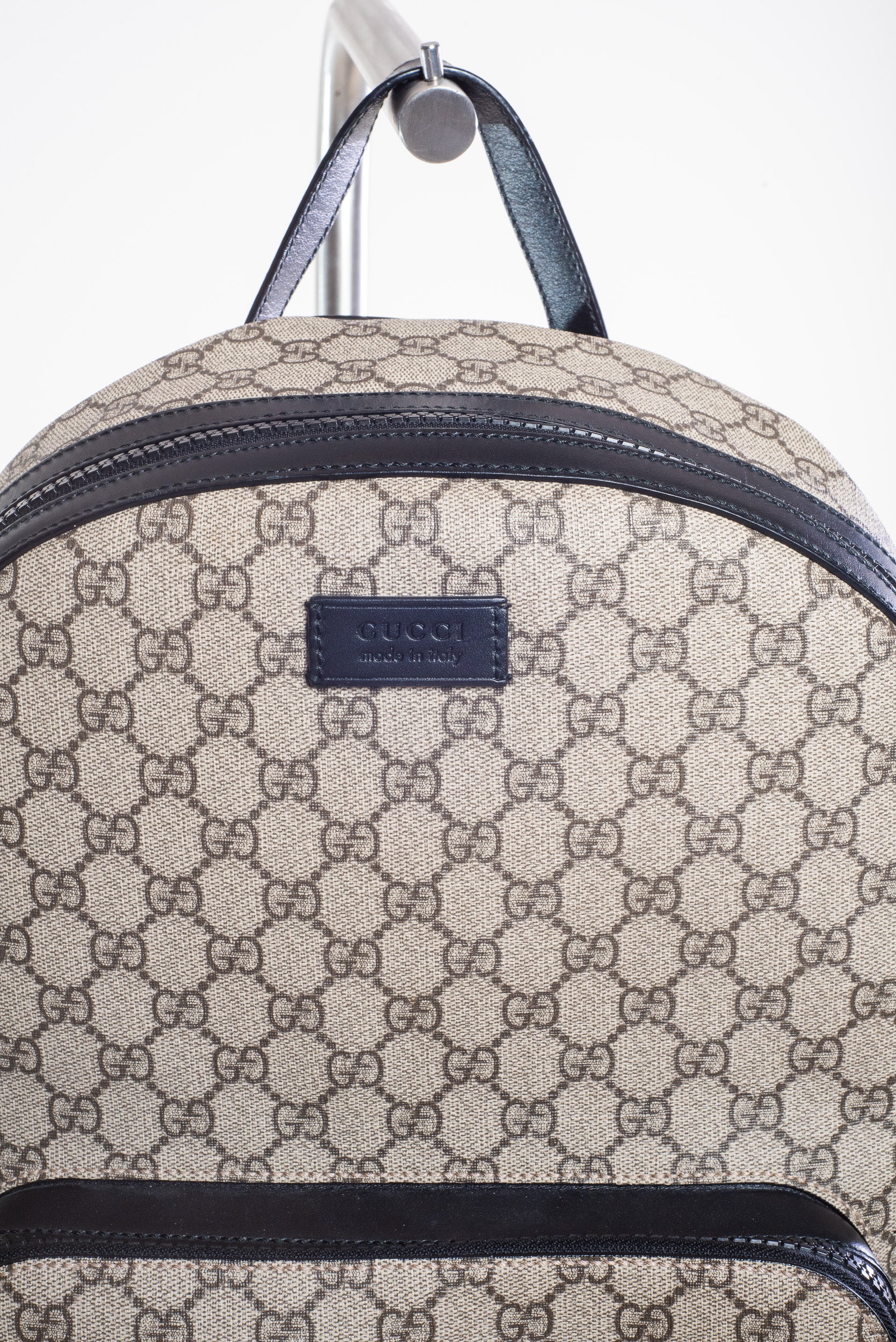 Close-up view of Gucci Medium GG Coated Canvas Supreme Eden Backpack