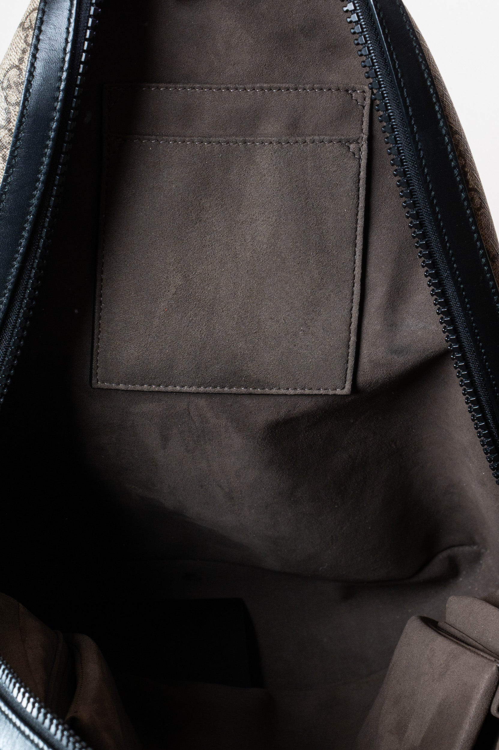 Interior of Gucci Medium GG Coated Canvas Supreme Eden Backpack