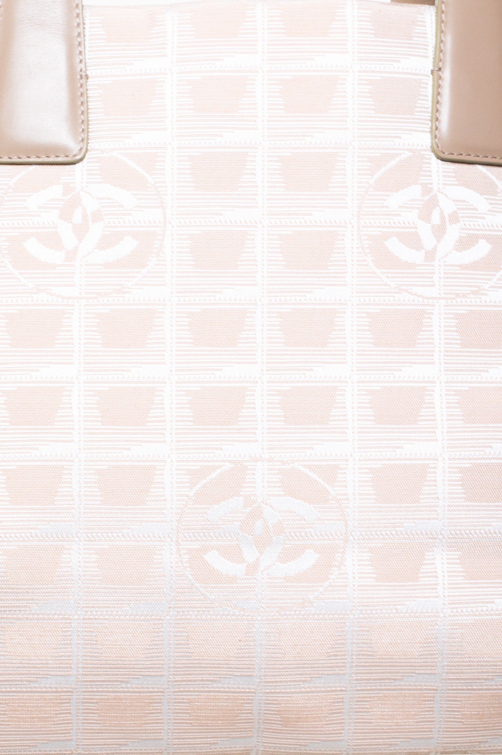 Close-up view of Chanel Beige Travel Line Tote Bag