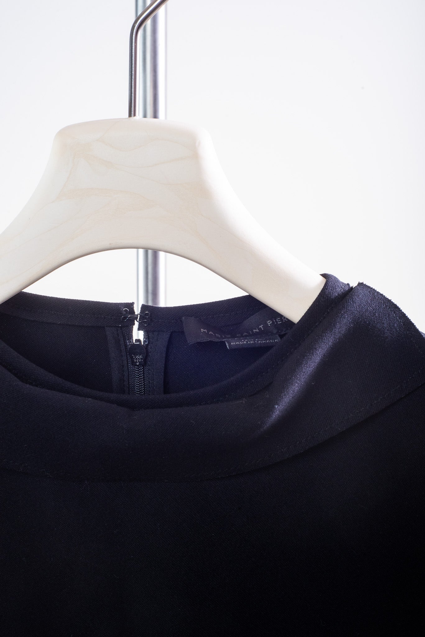 Close-up view of Marie Saint Pierre Black Neoprene Shift Dress